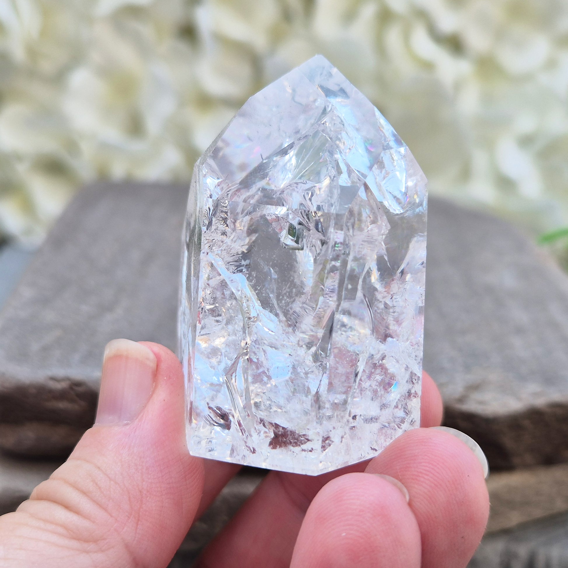 Fire and Ice Quartz polished point with striking internal crackle patterns. A high-energy crystal for amplification, focus, and energising your space.