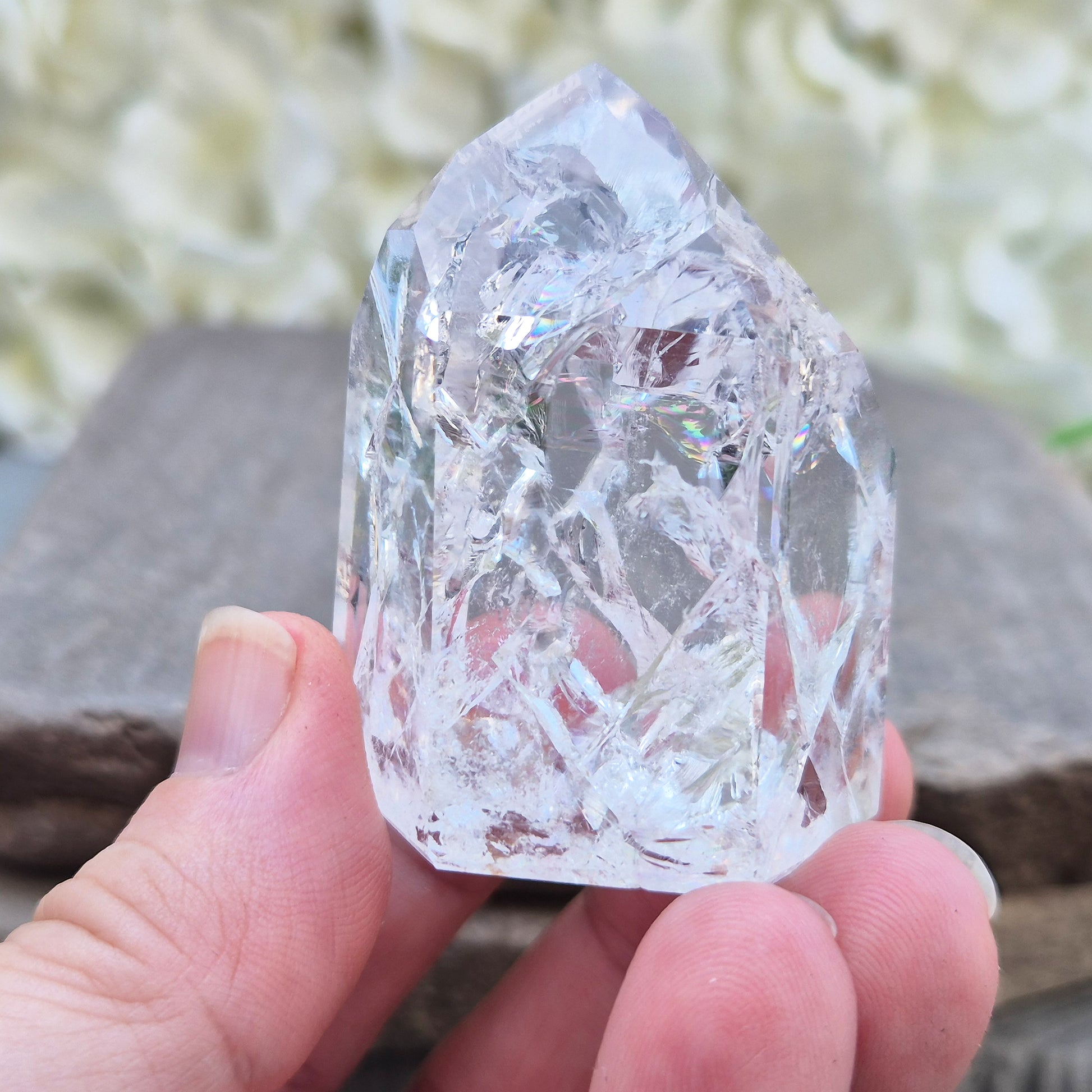 Fire and Ice Quartz polished point with striking internal crackle patterns. A high-energy crystal for amplification, focus, and energising your space.