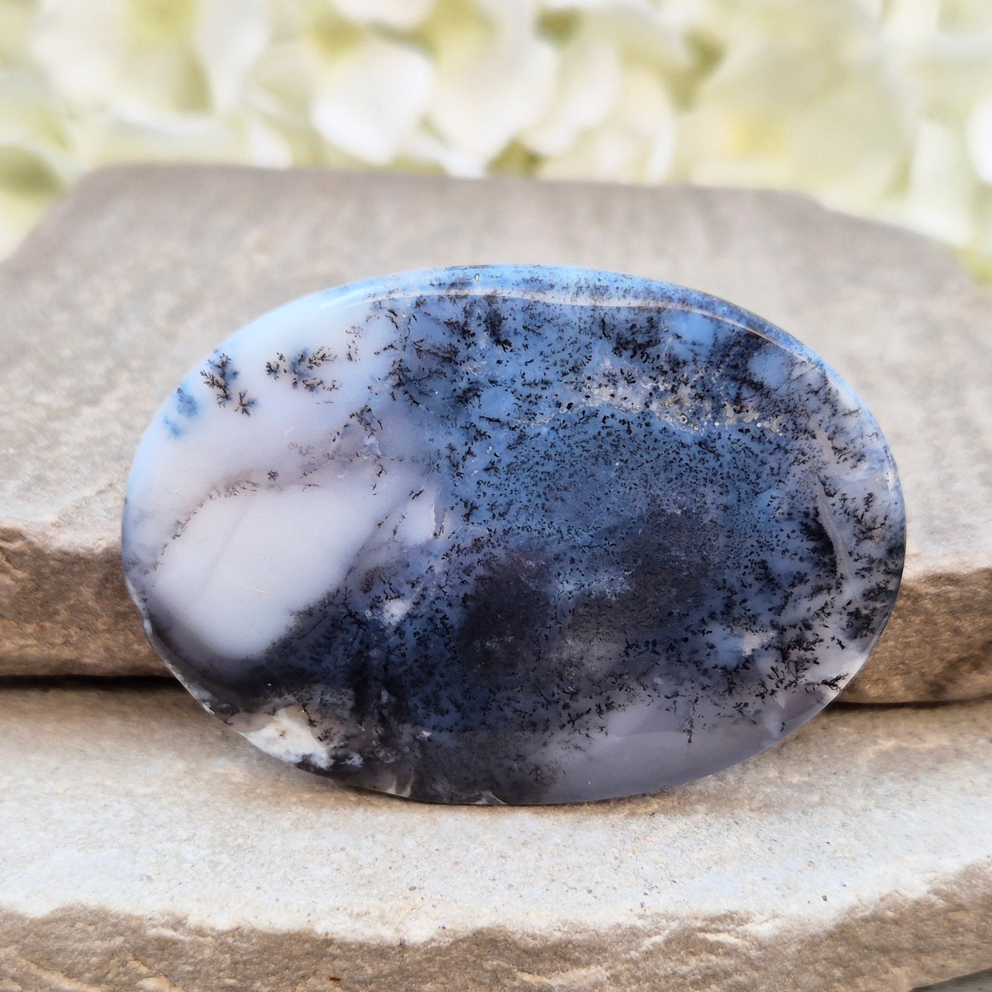 Merlinite Palm Stone - a grounding and intuitive crystal for meditation, inner balance and spiritual work. Smooth pocket stone for daily calm energy.