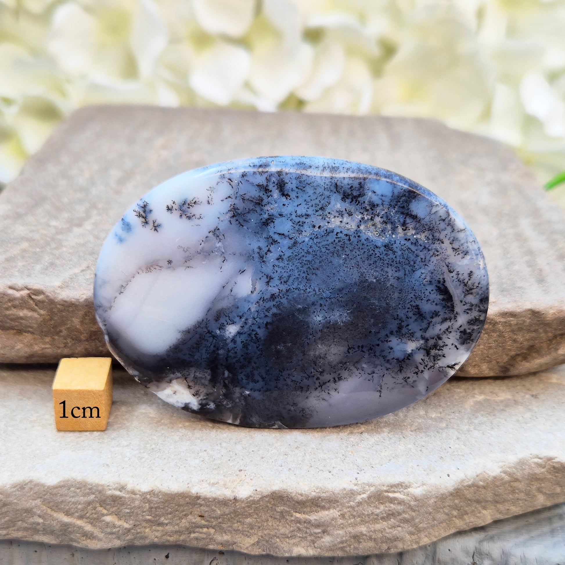 Merlinite Palm Stone - a grounding and intuitive crystal for meditation, inner balance and spiritual work. Smooth pocket stone for daily calm energy.