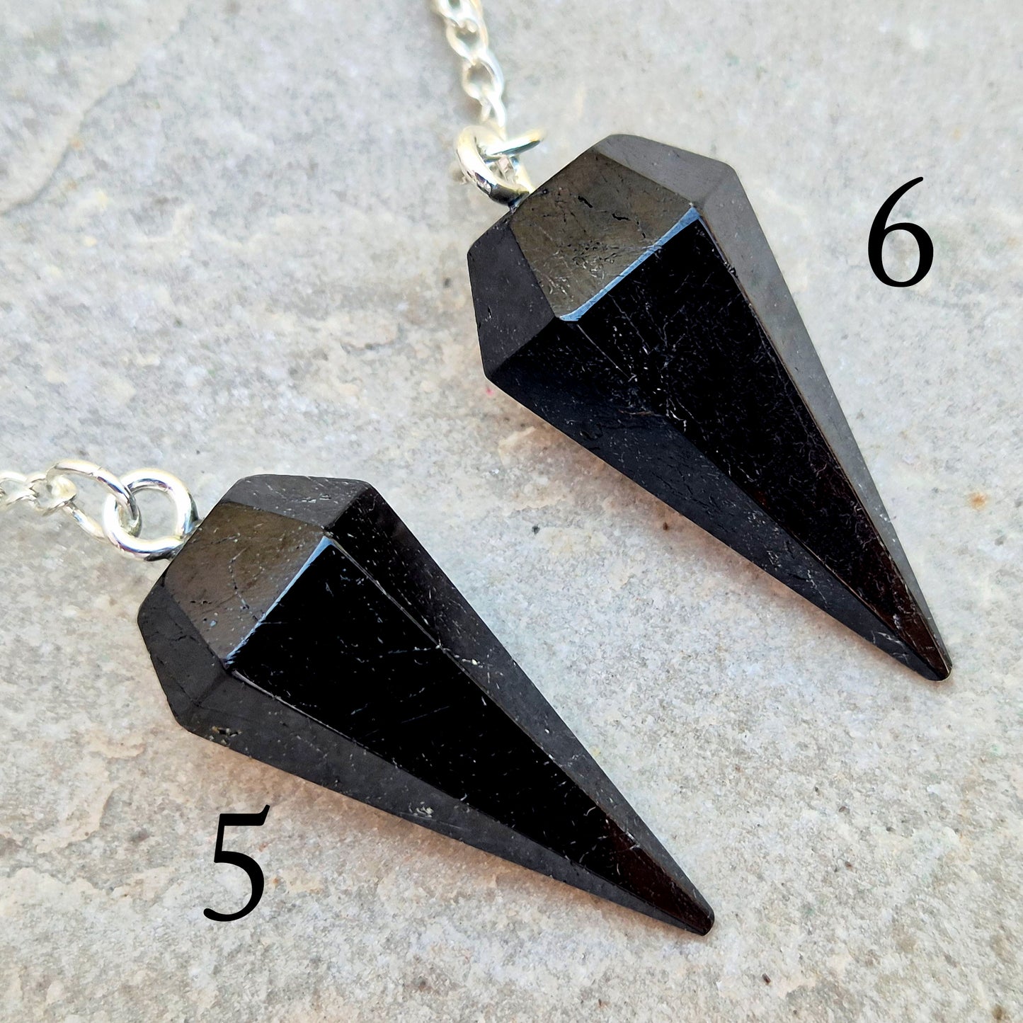 Black Tourmaline pendulum, polished with a silver chain, perfect for dowsing, decision-making, meditation, grounding and protection work at home."
