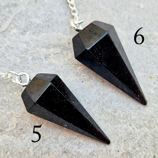 Black Tourmaline pendulum, polished with a silver chain, perfect for dowsing, decision-making, meditation, grounding and protection work at home."
