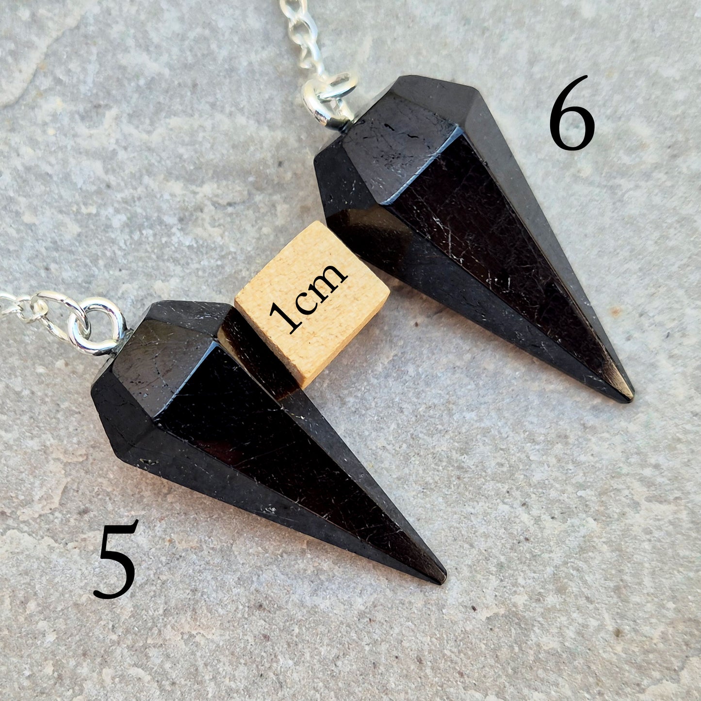 Black Tourmaline pendulum, polished with a silver chain, perfect for dowsing, decision-making, meditation, grounding and protection work at home."
