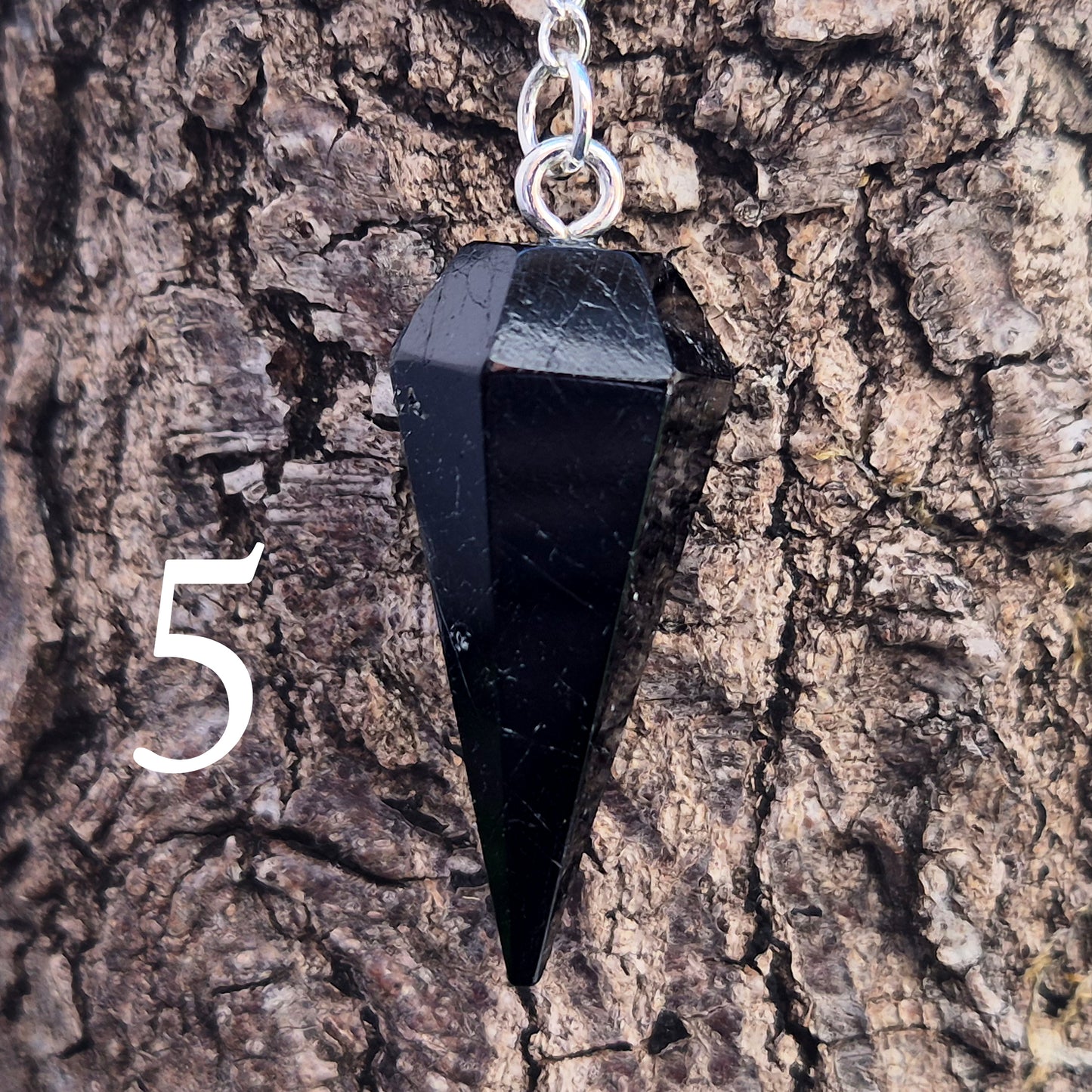 Black Tourmaline pendulum, polished with a silver chain, perfect for dowsing, decision-making, meditation, grounding and protection work at home."