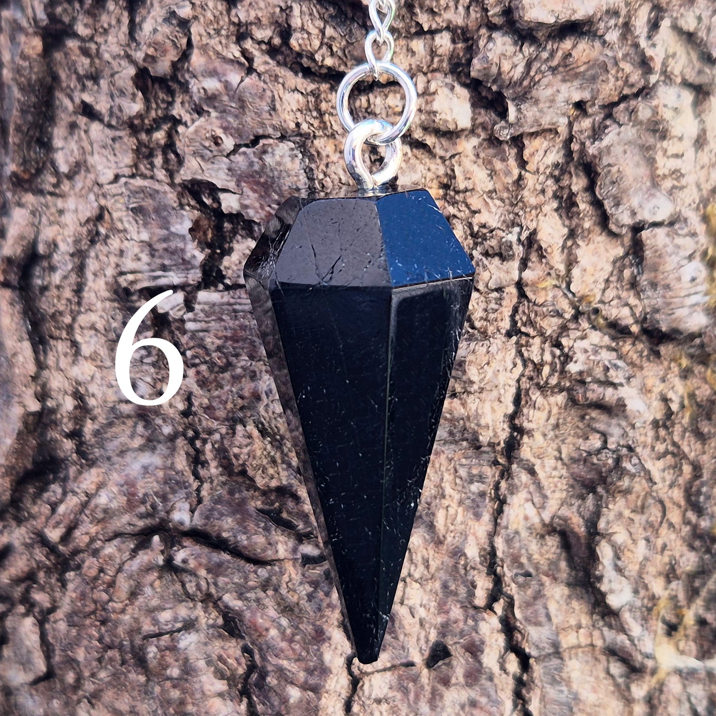 Black Tourmaline pendulum, polished with a silver chain, perfect for dowsing, decision-making, meditation, grounding and protection work at home."