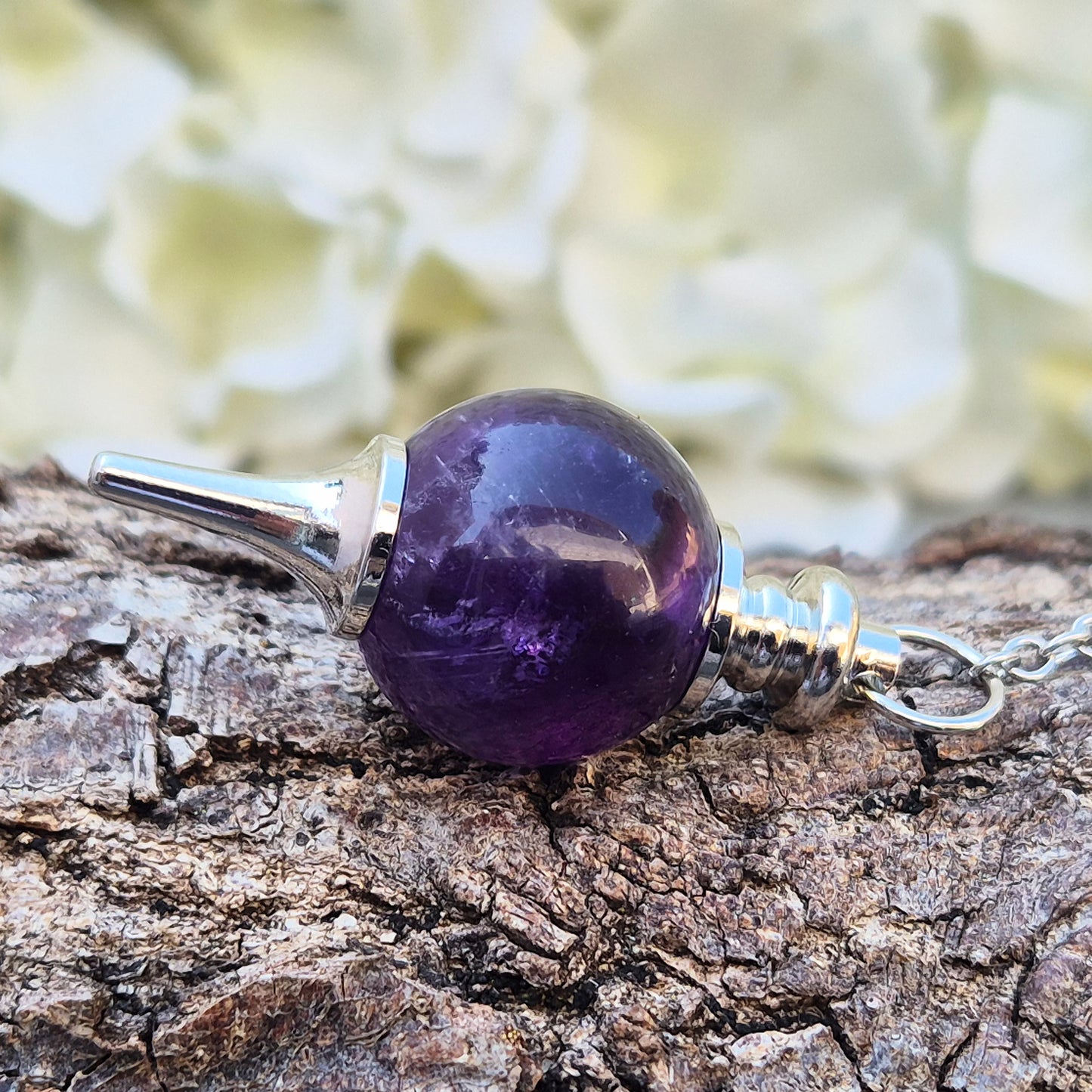 Amethyst pendulum with ball, ideal for dowsing, divination, and energy work. A beautiful tool for spiritual practice, tarot readings, and crystal healing.