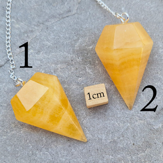 Polished Orange Calcite crystal pendulum on a silver colour chain, perfect for dowsing, decision-making, crystal healing, boosting creativity and energy work.