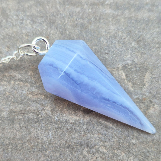 Blue Lace Agate crystal pendulum, known for its calming energy. Ideal for dowsing, spiritual guidance, and bringing a steady, peaceful feel.