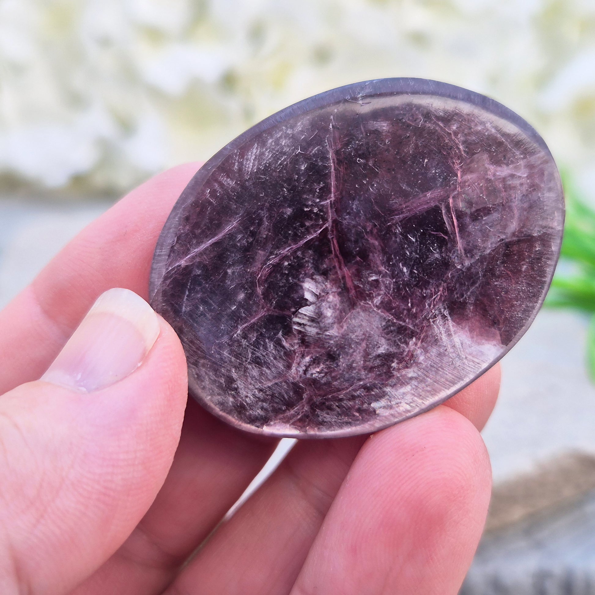 Metallic lilac Mica palm stone. Smooth, reflective, and grounding. Supports focus, calm emotions, and adds uplifting energy to any space.