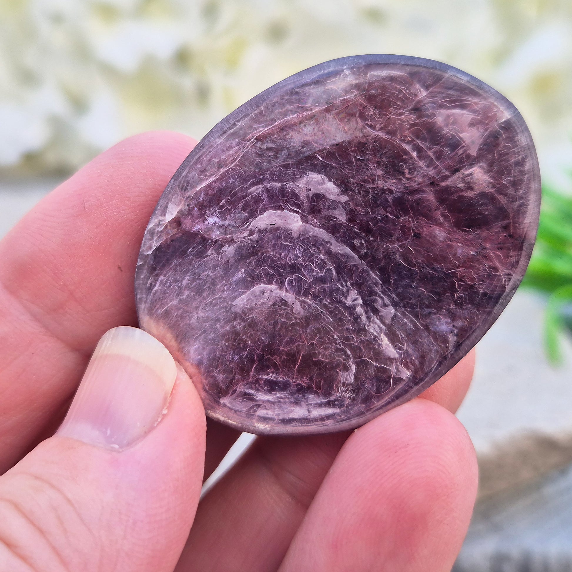 Metallic lilac Mica palm stone. Smooth, reflective, and grounding. Supports focus, calm emotions, and adds uplifting energy to any space.