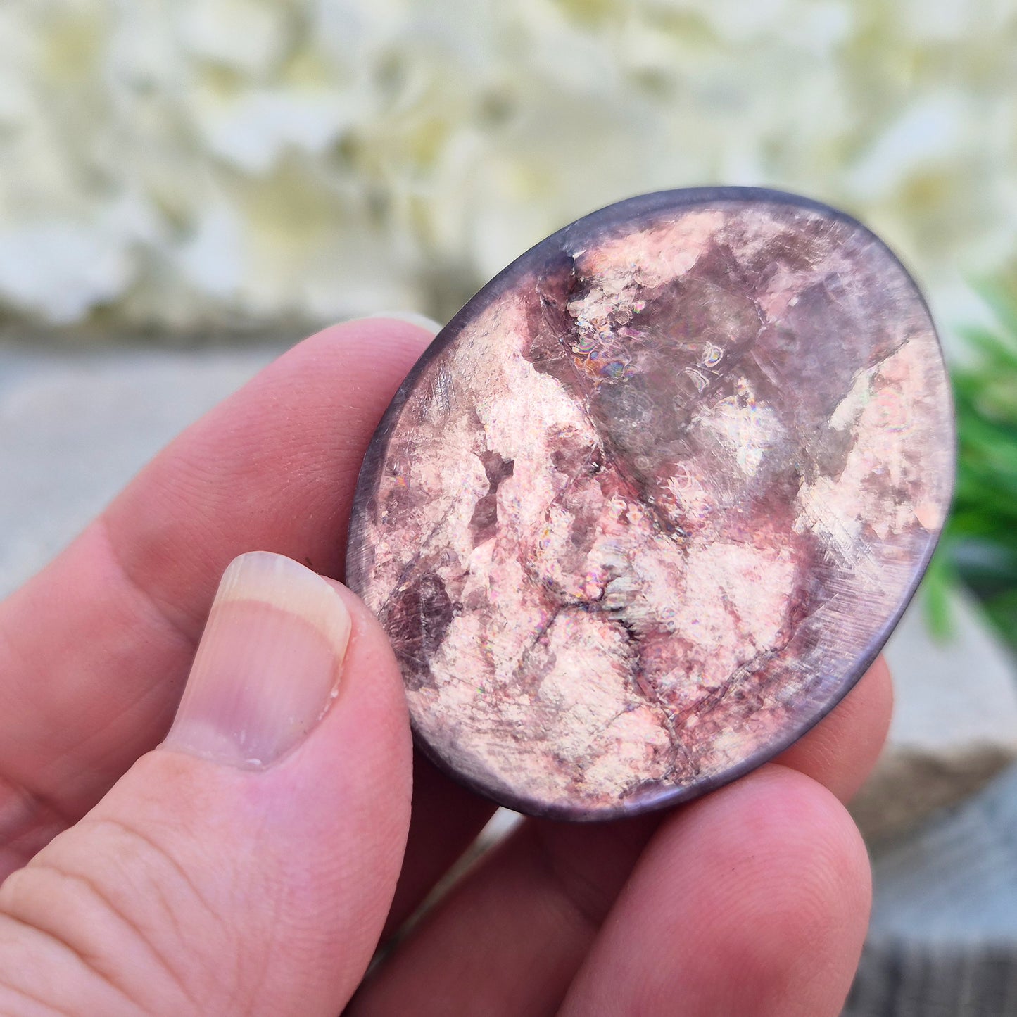 Metallic lilac Mica palm stone. Smooth, reflective, and grounding. Supports focus, calm emotions, and adds uplifting energy to any space.