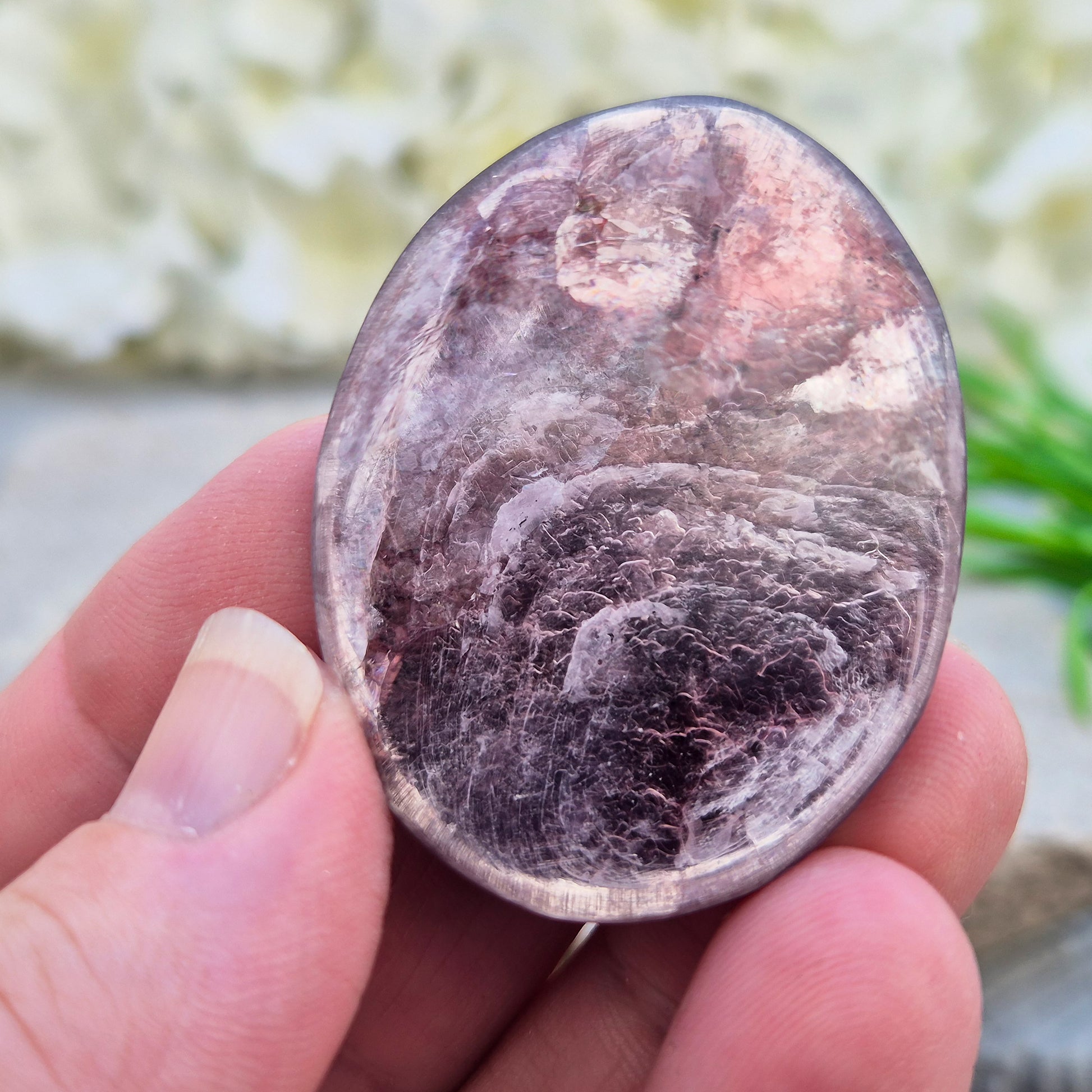 Metallic lilac Mica palm stone. Smooth, reflective, and grounding. Supports focus, calm emotions, and adds uplifting energy to any space.