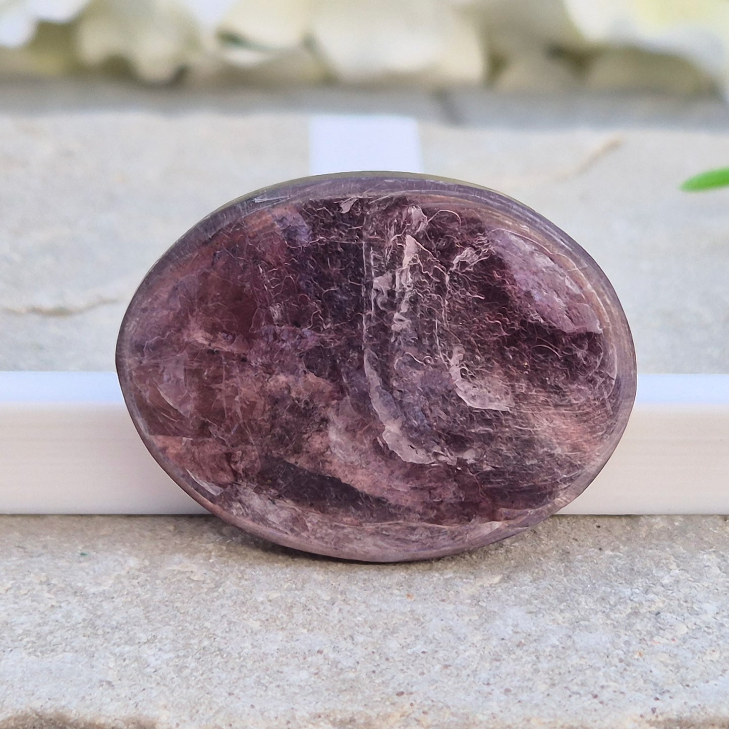 Metallic lilac Mica palm stone. Smooth, reflective, and grounding. Supports focus, calm emotions, and adds uplifting energy to any space.