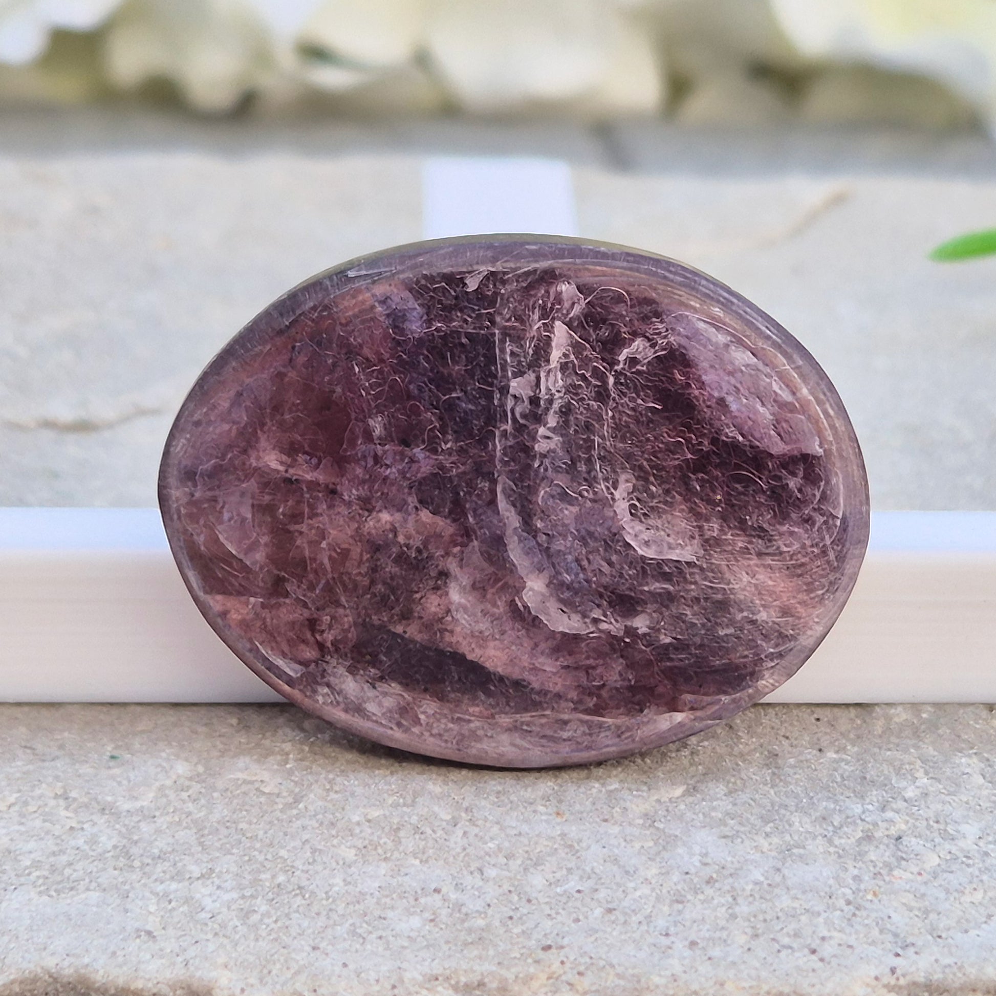 Metallic lilac Mica palm stone. Smooth, reflective, and grounding. Supports focus, calm emotions, and adds uplifting energy to any space.