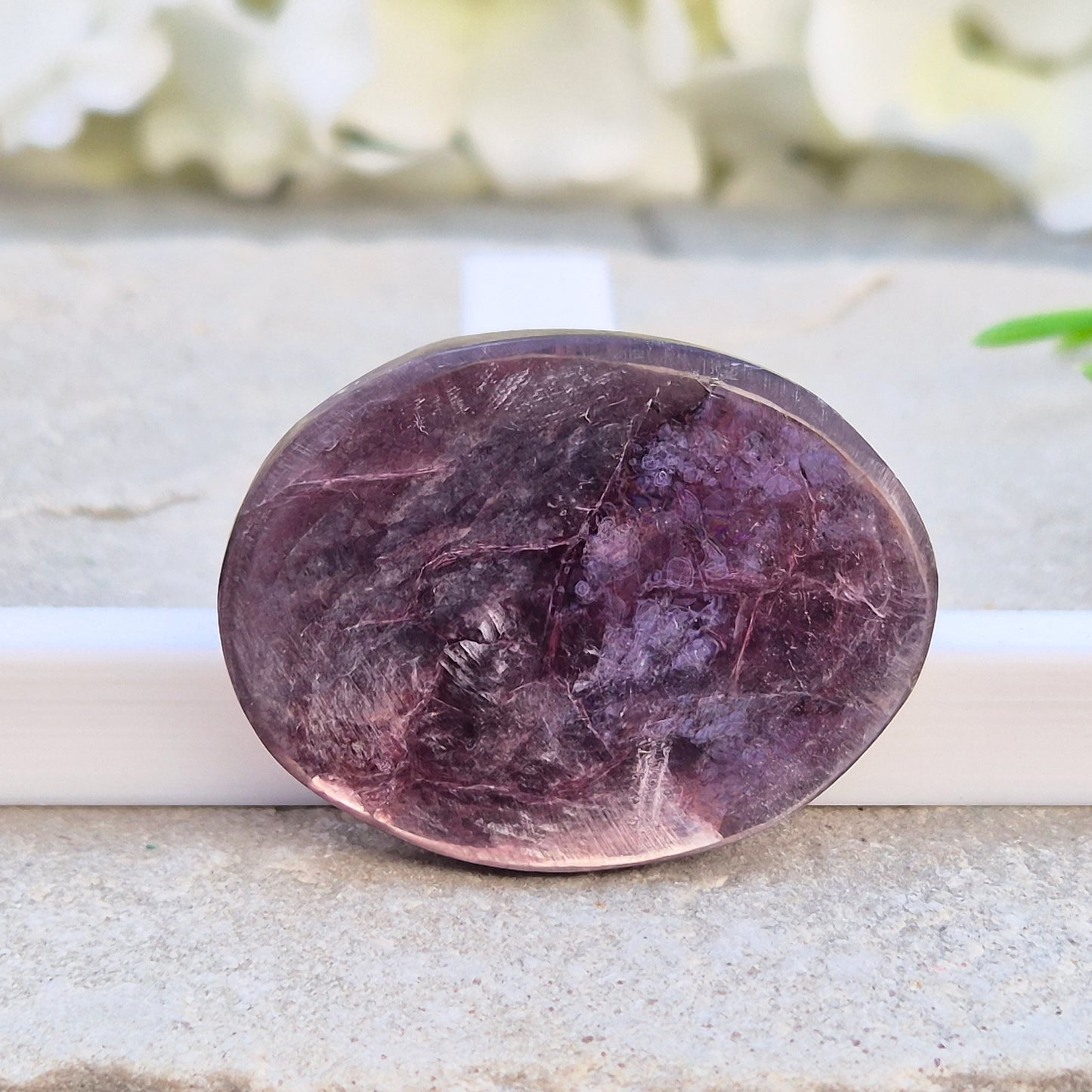 Metallic lilac Mica palm stone. Smooth, reflective, and grounding. Supports focus, calm emotions, and adds uplifting energy to any space.