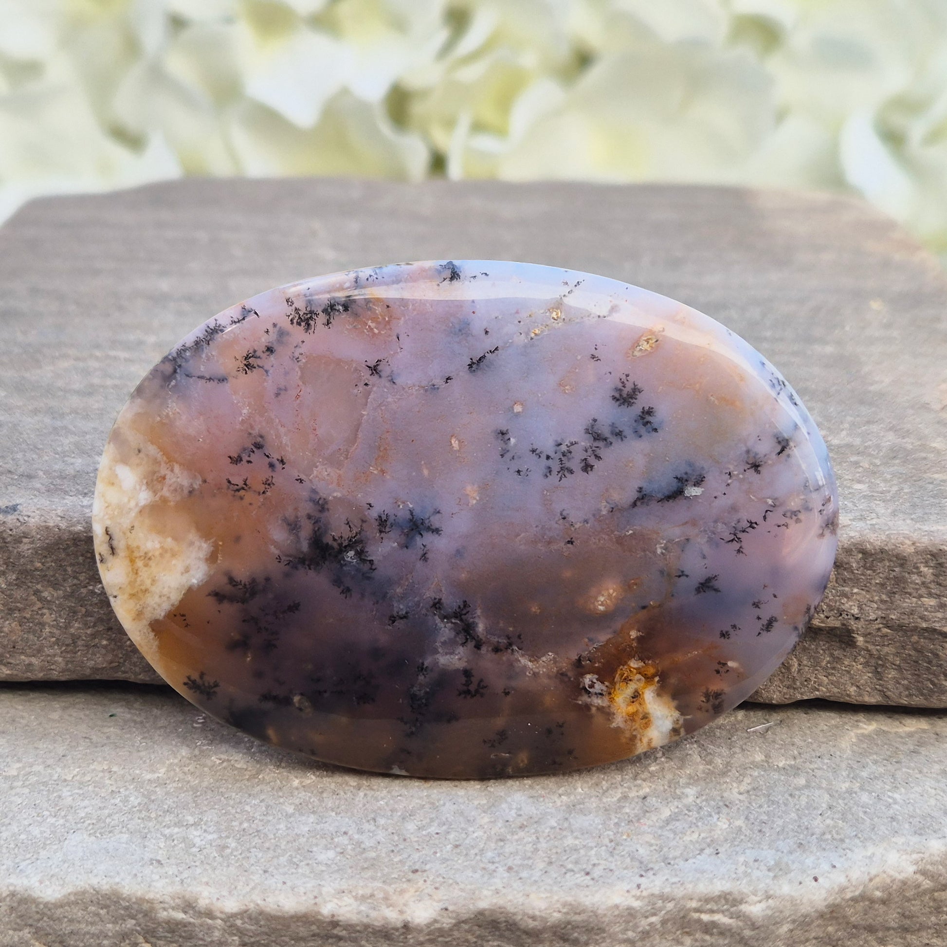 Merlinite Palm Stone - a grounding and intuitive crystal for meditation, inner balance and spiritual work. Smooth pocket stone for daily calm energy.