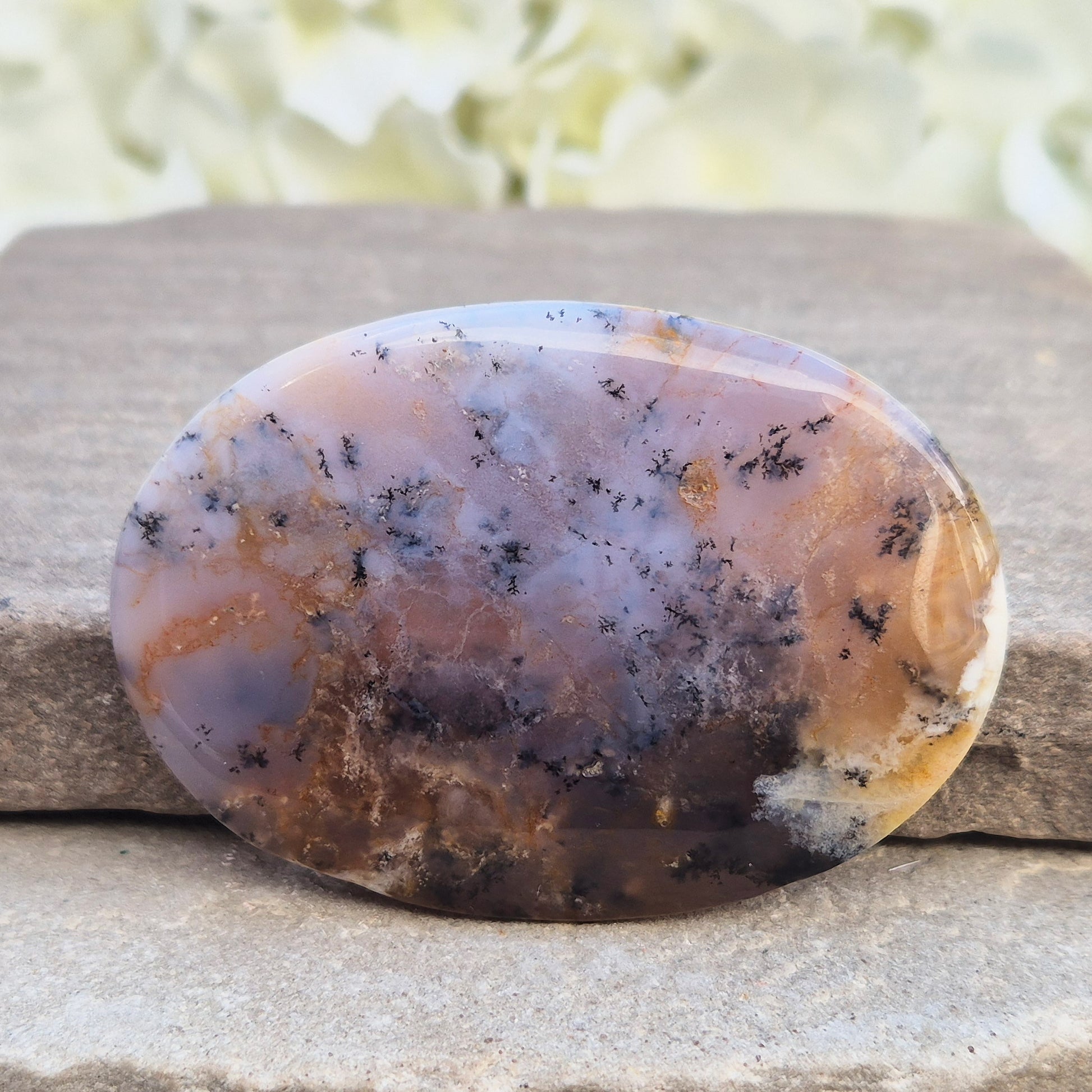 Merlinite Palm Stone - a grounding and intuitive crystal for meditation, inner balance and spiritual work. Smooth pocket stone for daily calm energy.