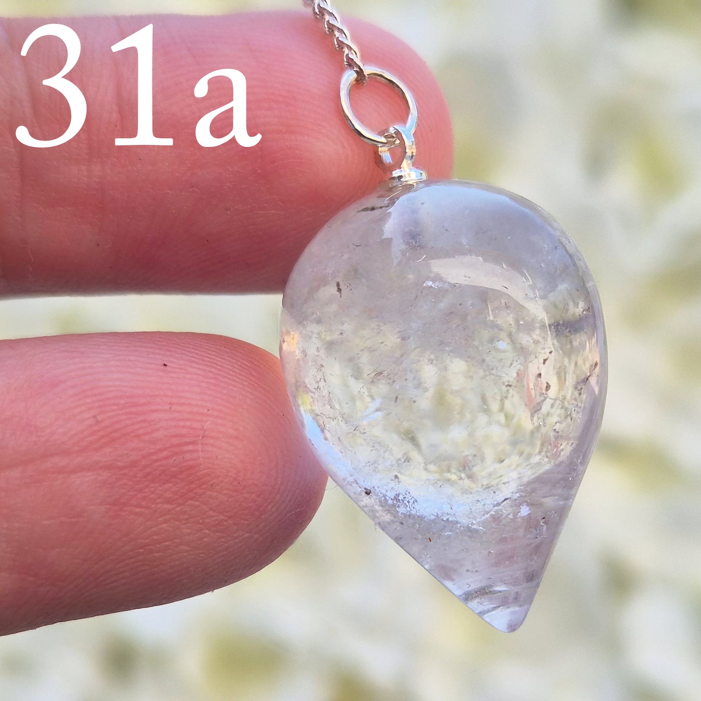 This Clear Quartz Crystal Pendulum from Brazil features a tear drop crystal shape and at the end of the chain is a clear bead. It will come with a pouch for safe keeping.