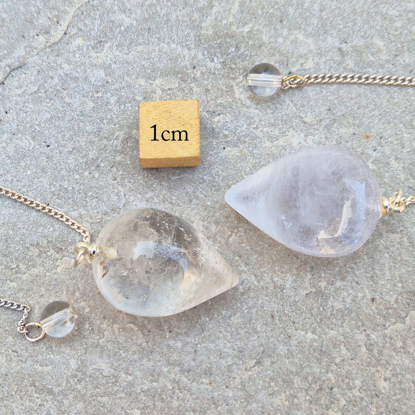 This Clear Quartz Crystal Pendulum from Brazil features a tear drop crystal shape and at the end of the chain is a clear bead. It will come with a pouch for safe keeping.