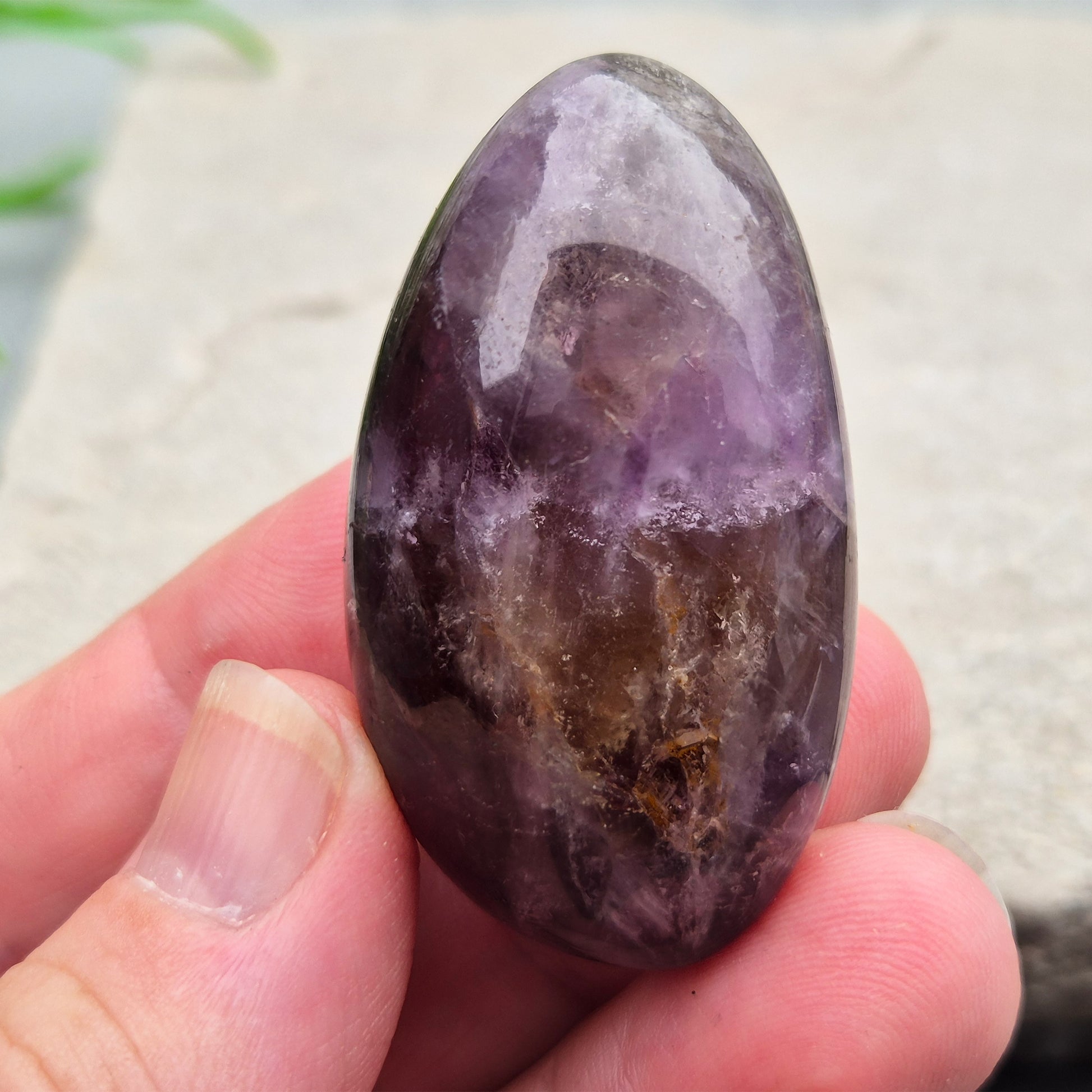 Ametrine polished palm stone with soft purple and golden tones. A natural blend of Amethyst and Citrine with a balanced, easy feel. 