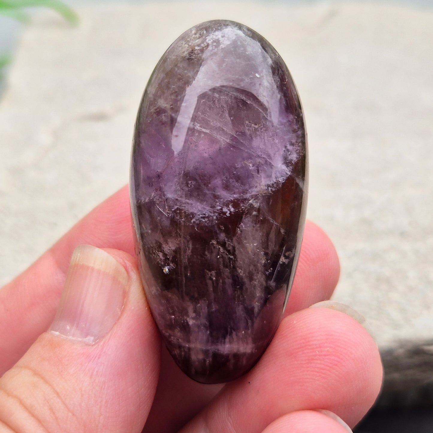 Ametrine polished palm stone with soft purple and golden tones. A natural blend of Amethyst and Citrine with a balanced, easy feel. 