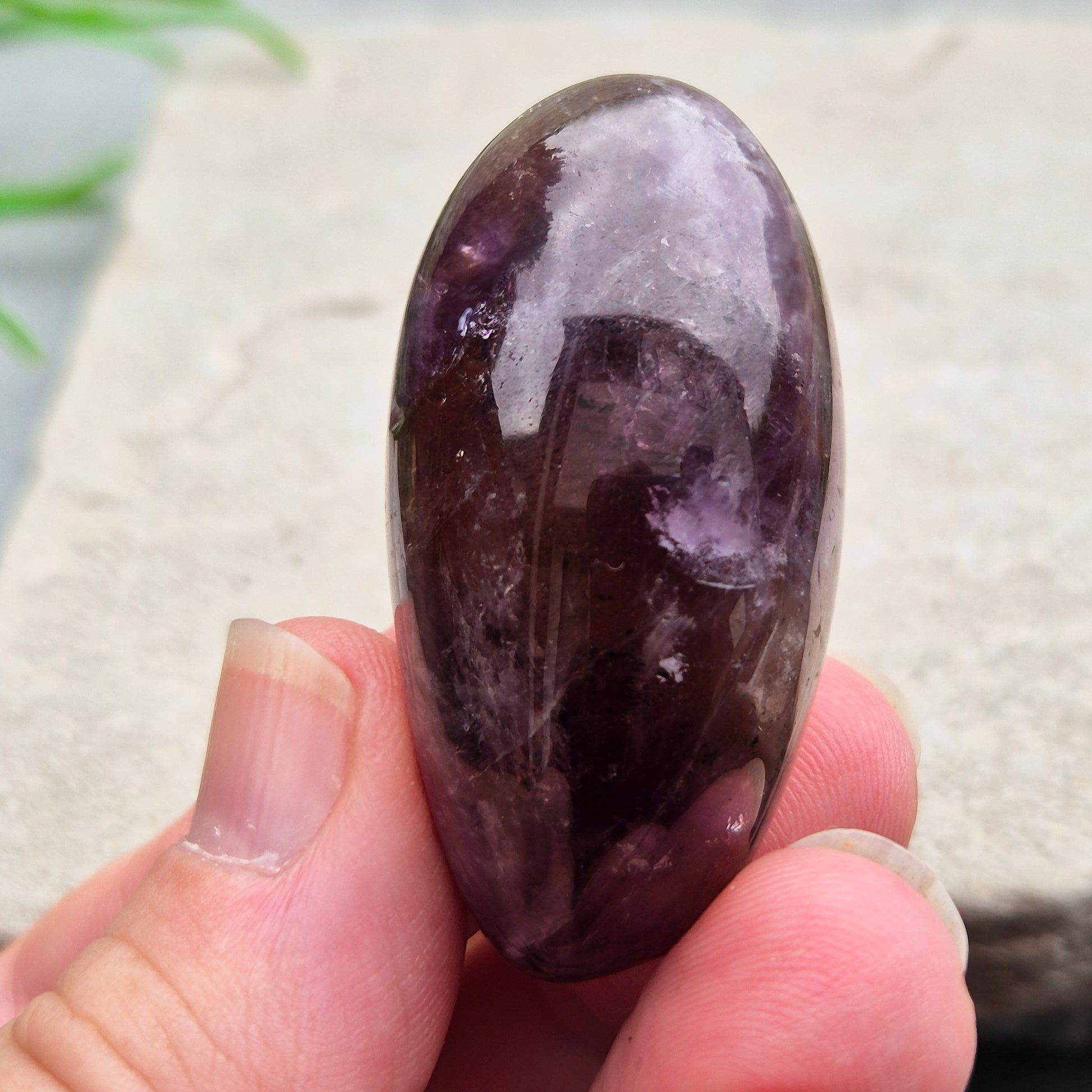 Ametrine polished palm stone with soft purple and golden tones. A natural blend of Amethyst and Citrine with a balanced, easy feel. 
