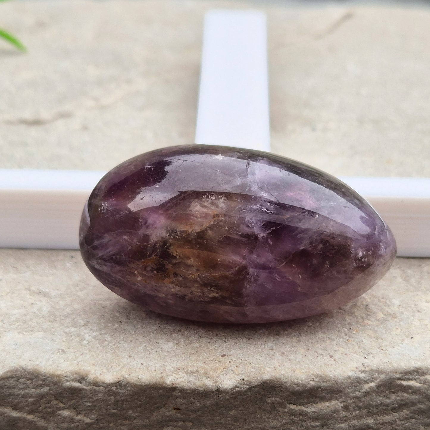 Ametrine polished palm stone with soft purple and golden tones. A natural blend of Amethyst and Citrine with a balanced, easy feel. 