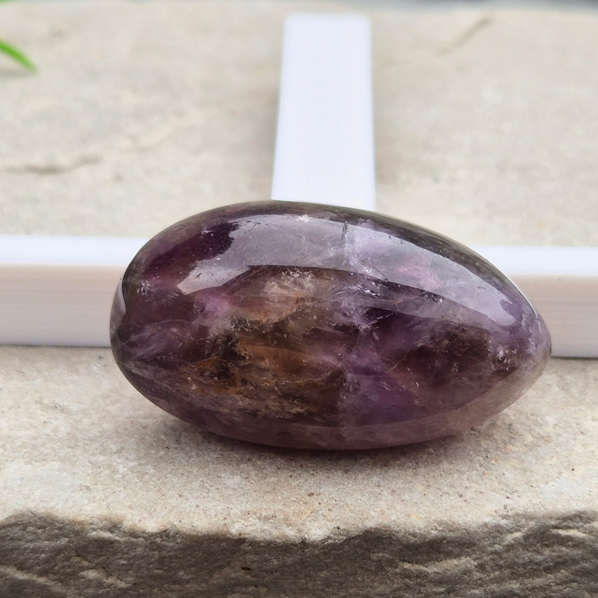 Ametrine polished palm stone with soft purple and golden tones. A natural blend of Amethyst and Citrine with a balanced, easy feel. 