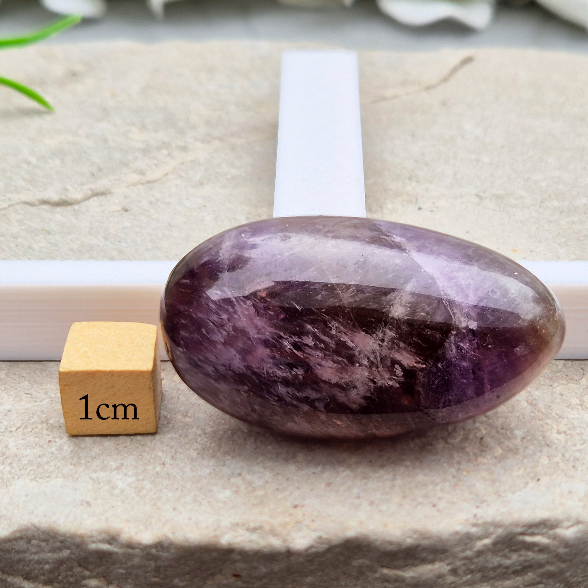 Ametrine polished palm stone with soft purple and golden tones. A natural blend of Amethyst and Citrine with a balanced, easy feel. 