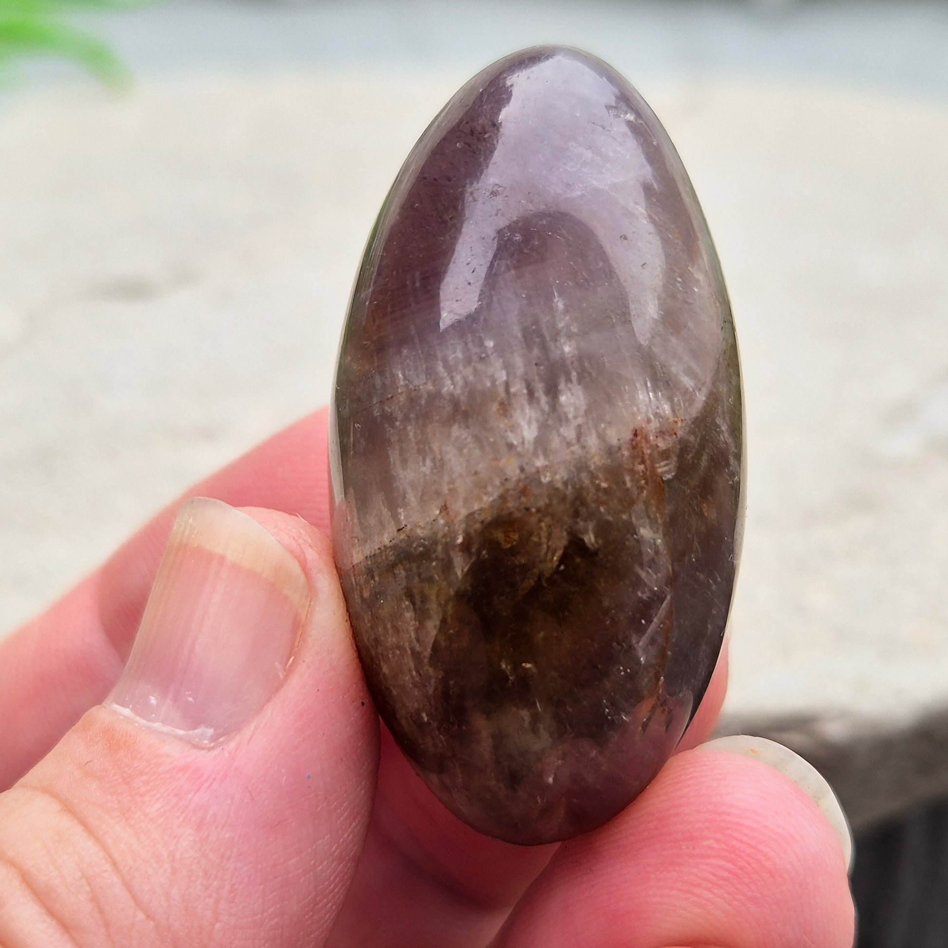Ametrine polished palm stone with soft purple and golden tones. A natural blend of Amethyst and Citrine with a balanced, easy feel. 