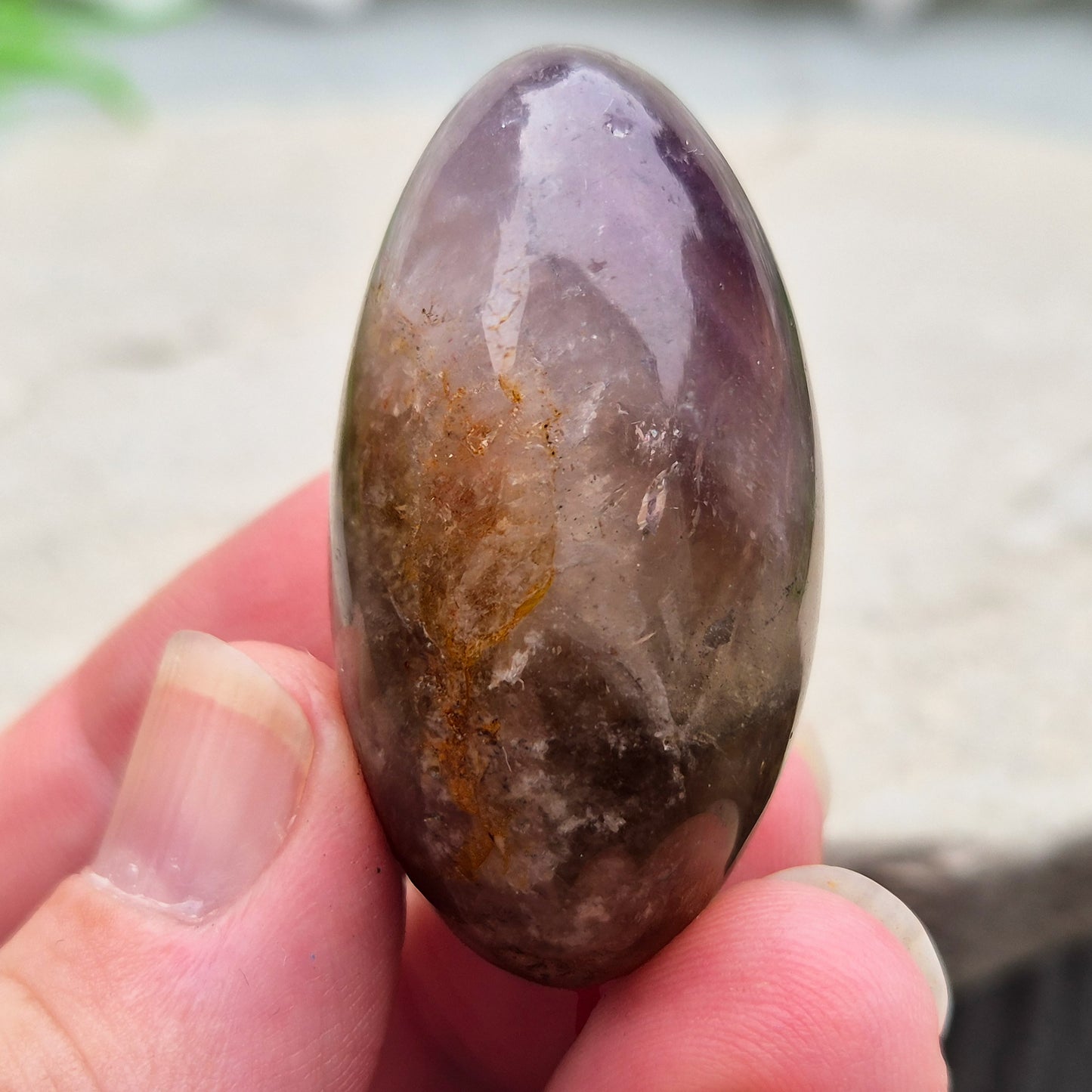 Ametrine polished palm stone with soft purple and golden tones. A natural blend of Amethyst and Citrine with a balanced, easy feel. 