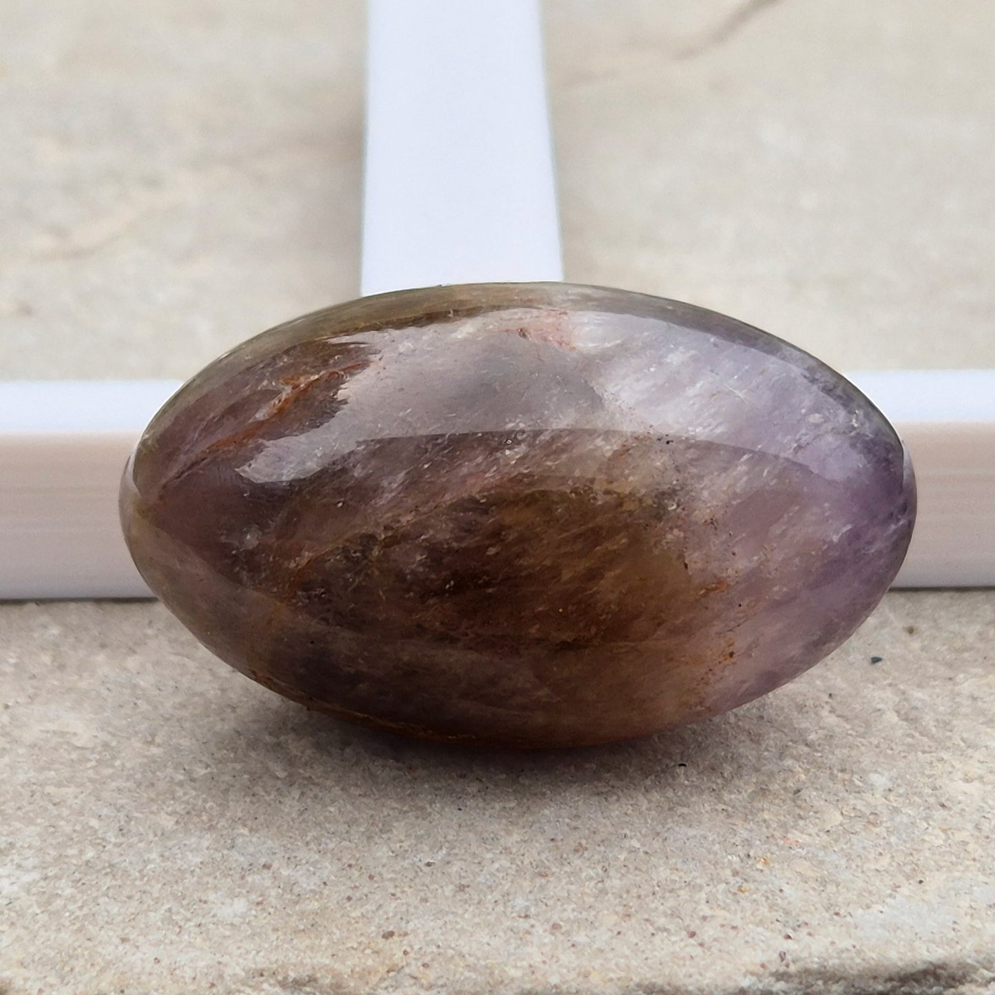 Ametrine polished palm stone with soft purple and golden tones. A natural blend of Amethyst and Citrine with a balanced, easy feel. 