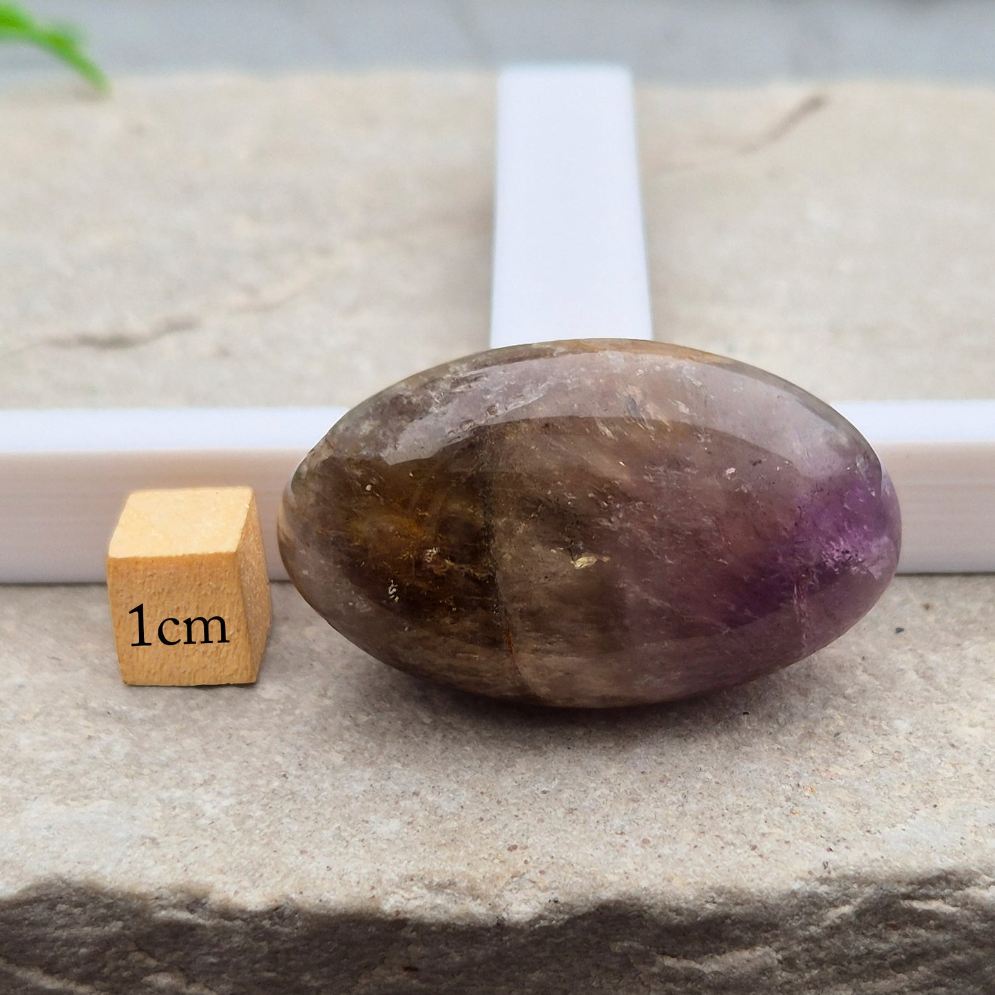 Ametrine polished palm stone with soft purple and golden tones. A natural blend of Amethyst and Citrine with a balanced, easy feel. 