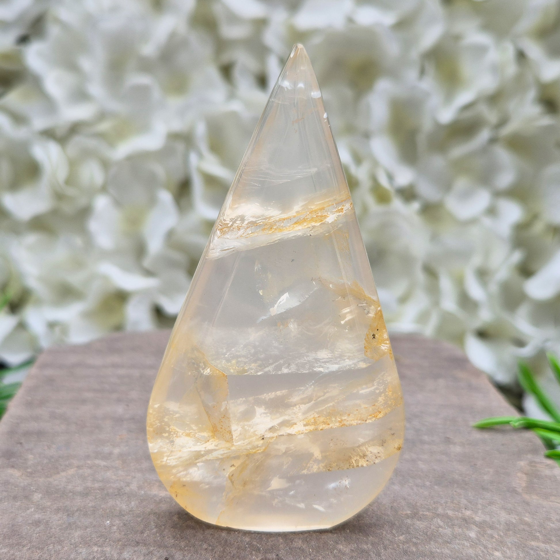 Golden Healer Quartz Teardrop – polished self-standing crystal with golden hematoid inclusions. Brazilian quartz for meditation, altars & spiritual guidance.