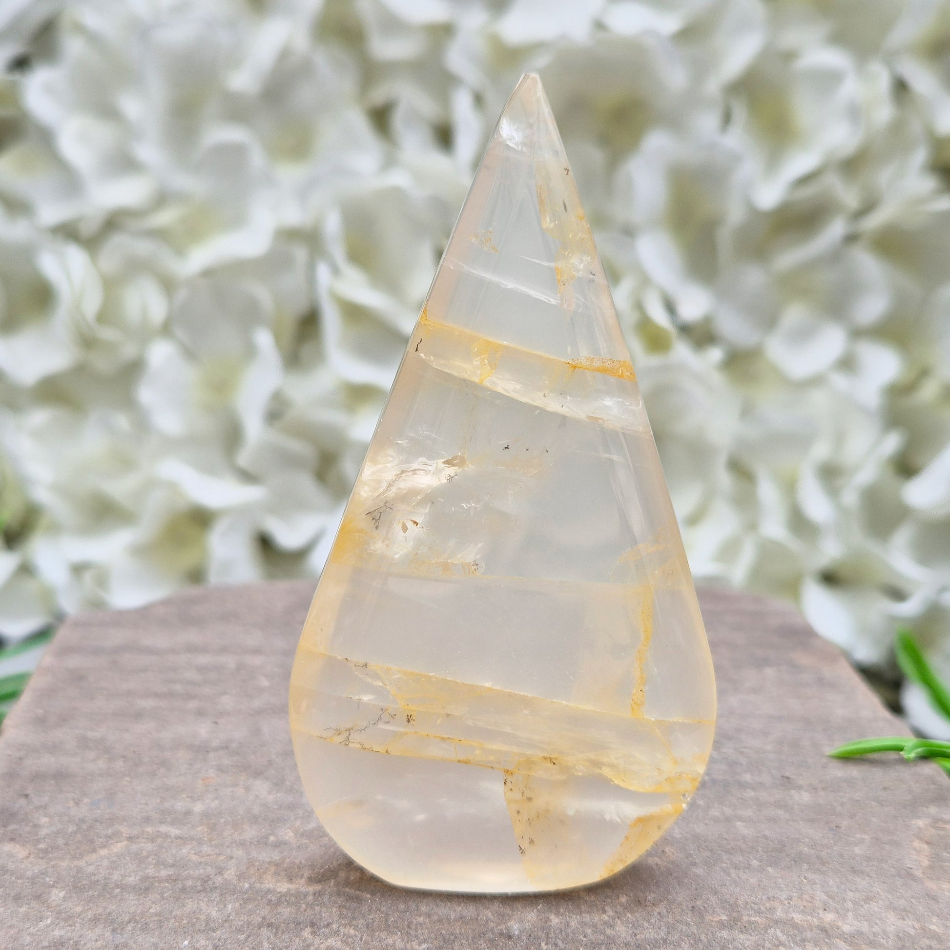 Golden Healer Quartz Teardrop – polished self-standing crystal with golden hematoid inclusions. Brazilian quartz for meditation, altars & spiritual guidance.