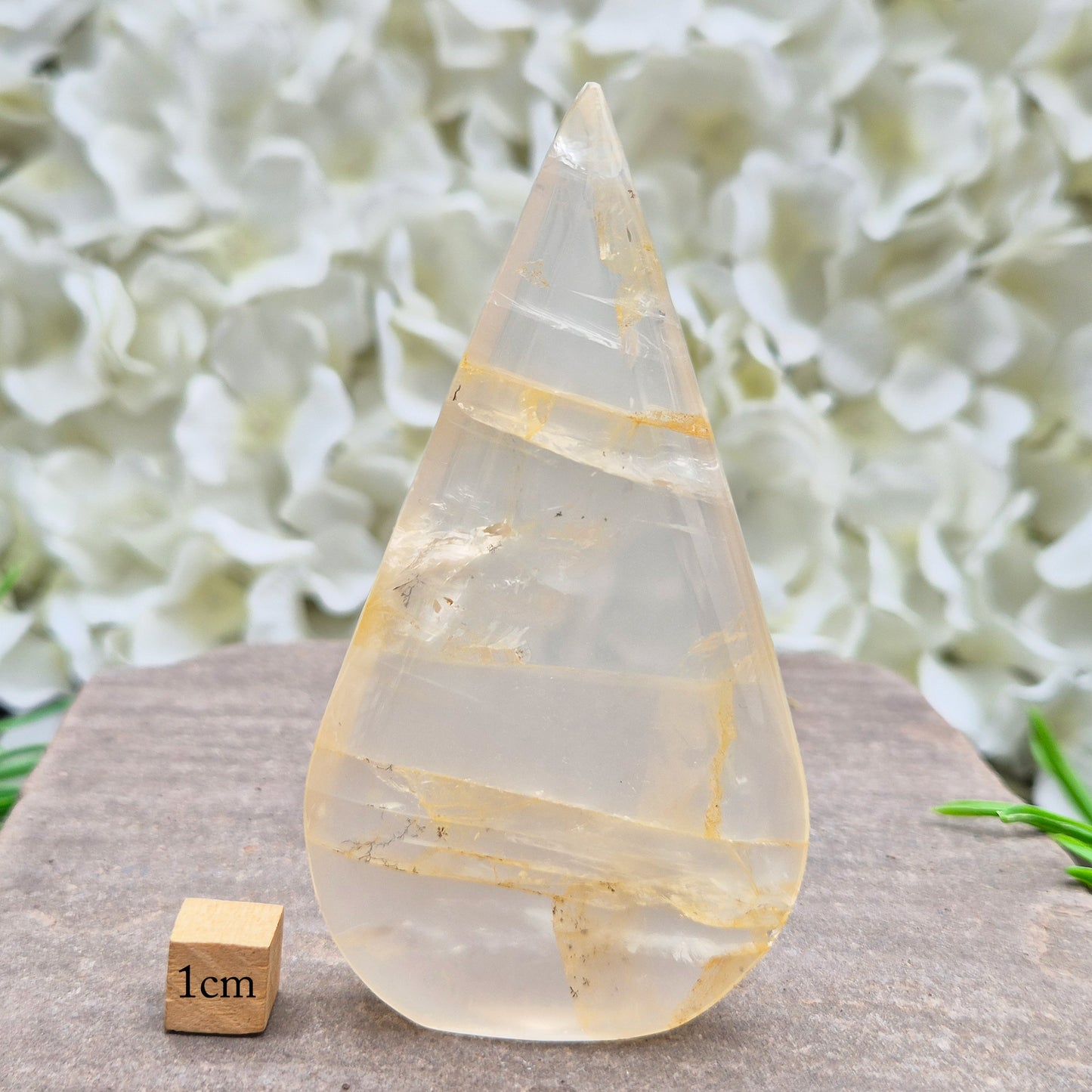 Golden Healer Quartz Teardrop – polished self-standing crystal with golden hematoid inclusions. Brazilian quartz for meditation, altars & spiritual guidance.