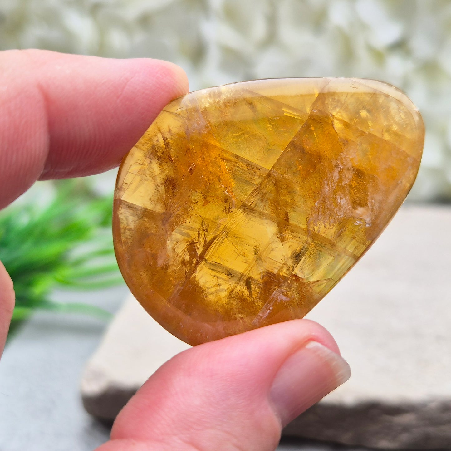 Shop Honey Calcite Palm Stones – smooth, pocket-sized crystals in rich honey tones. Perfect for meditation, mindfulness & everyday carry. UK crystal shop.