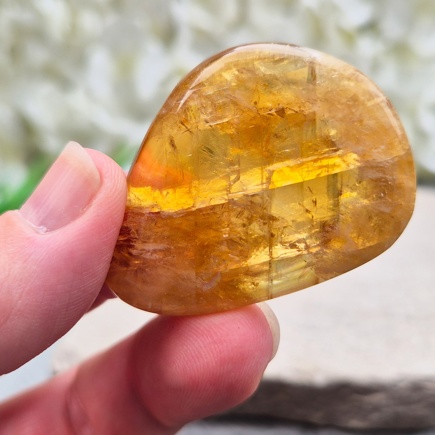 Shop Honey Calcite Palm Stones – smooth, pocket-sized crystals in rich honey tones. Perfect for meditation, mindfulness & everyday carry. UK crystal shop.
