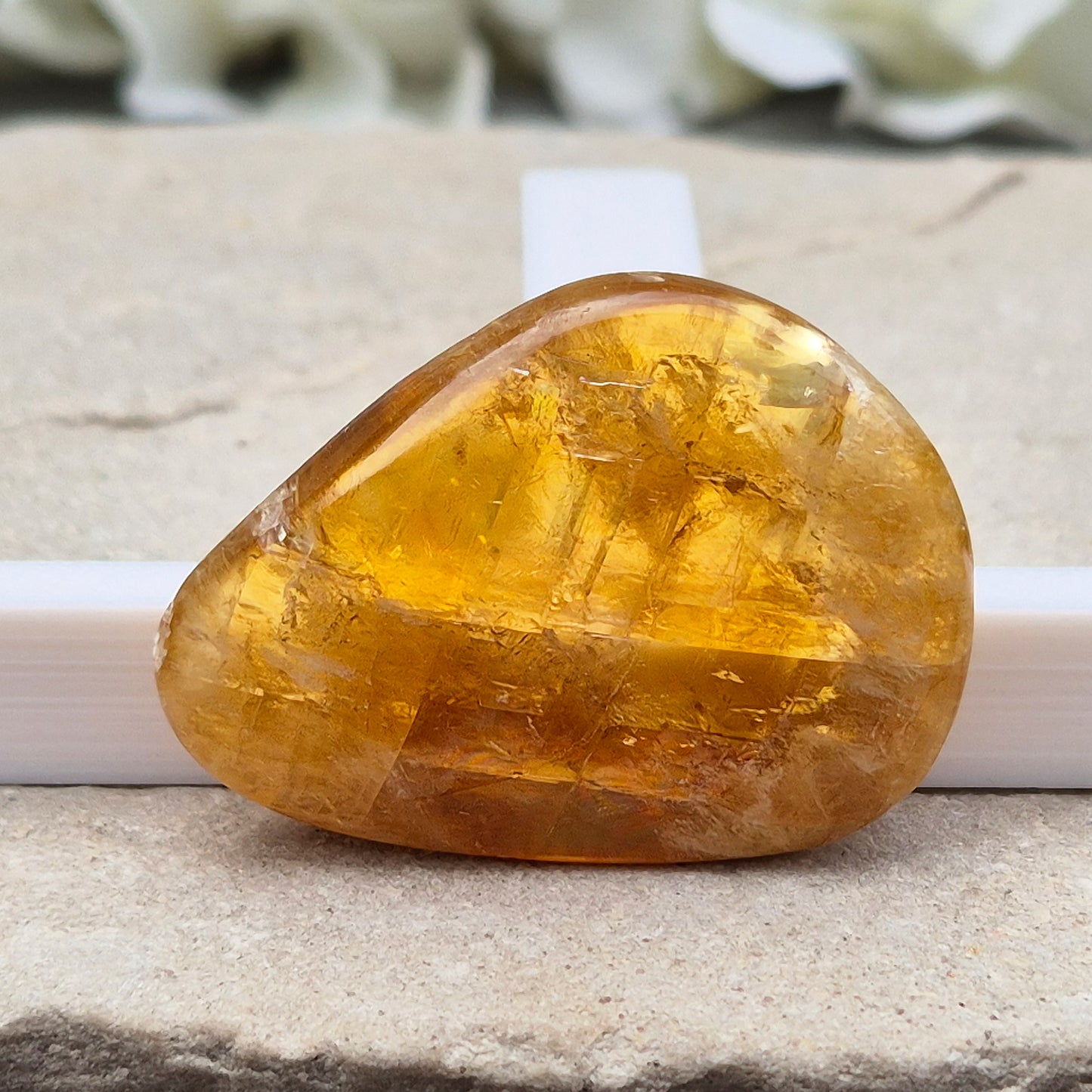 Shop Honey Calcite Palm Stones – smooth, pocket-sized crystals in rich honey tones. Perfect for meditation, mindfulness & everyday carry. UK crystal shop.