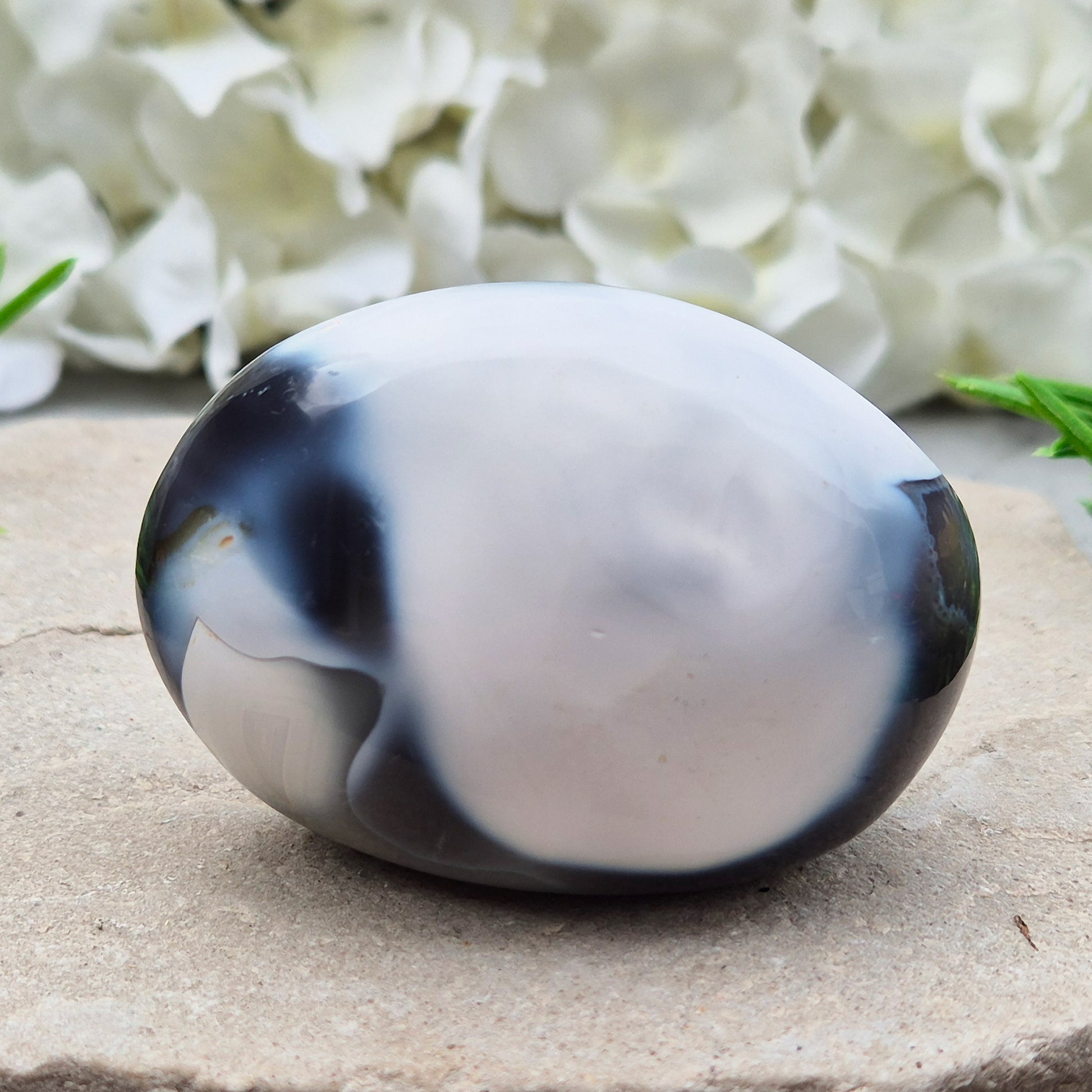 Orca Agate also known as Grey Agate, it has black, dark charcoal grey and white patterning, with soft, out-of-focus white markings as a natural feature of the stone. No two pieces show the same pattern and colouring.