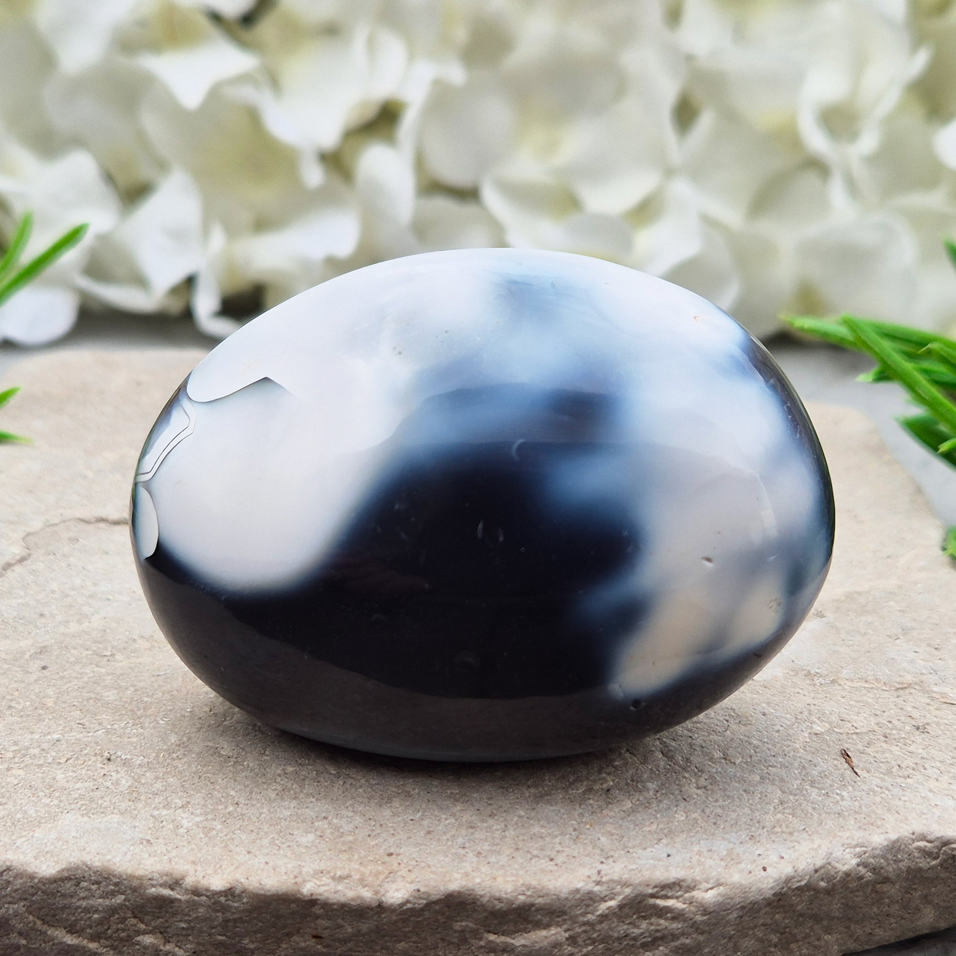 Orca Agate also known as Grey Agate, it has black, dark charcoal grey and white patterning, with soft, out-of-focus white markings as a natural feature of the stone. No two pieces show the same pattern and colouring.