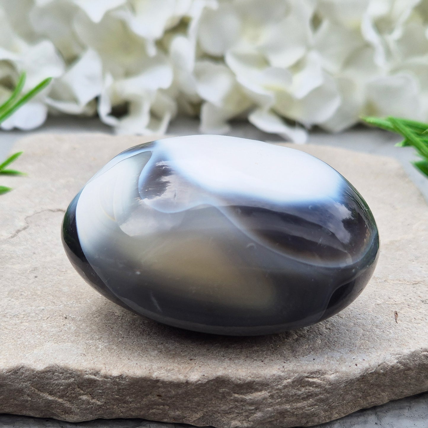 Orca Agate also known as Grey Agate, it has black, dark charcoal grey and white patterning, with soft, out-of-focus white markings as a natural feature of the stone. No two pieces show the same pattern and colouring.