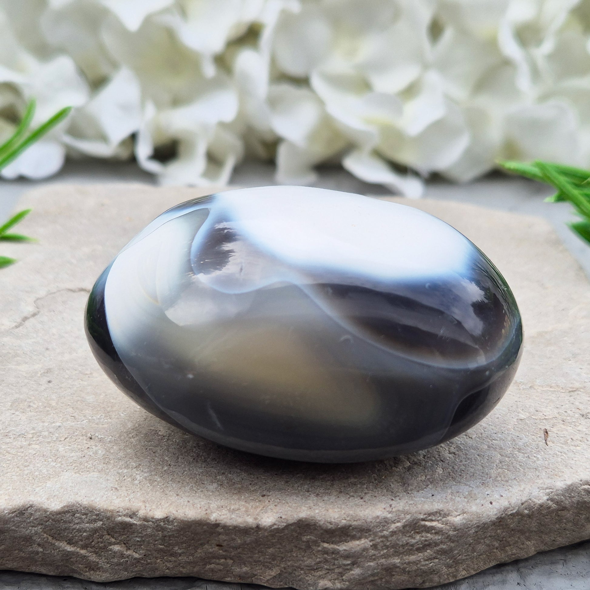 Orca Agate also known as Grey Agate, it has black, dark charcoal grey and white patterning, with soft, out-of-focus white markings as a natural feature of the stone. No two pieces show the same pattern and colouring.