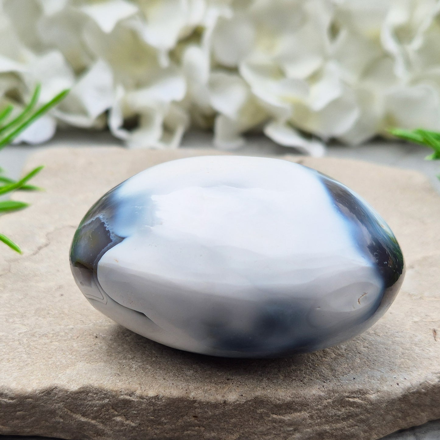 Orca Agate also known as Grey Agate, it has black, dark charcoal grey and white patterning, with soft, out-of-focus white markings as a natural feature of the stone. No two pieces show the same pattern and colouring.