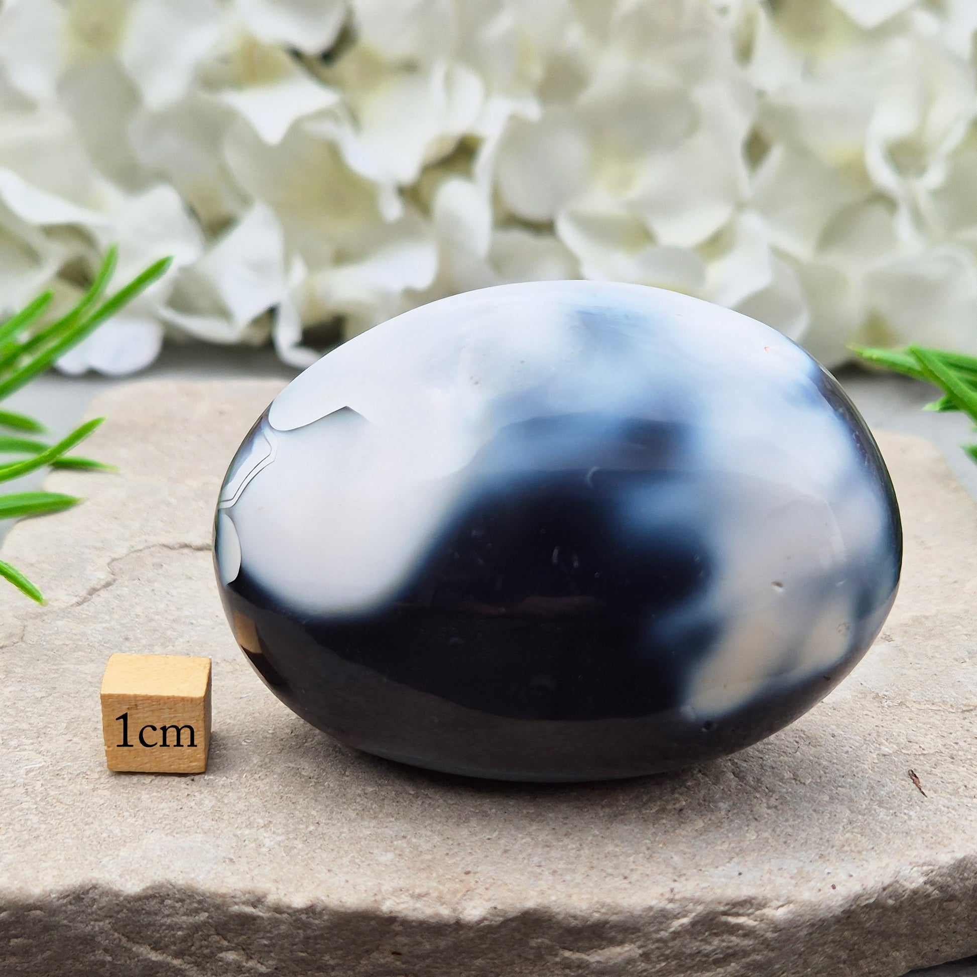 Orca Agate also known as Grey Agate, it has black, dark charcoal grey and white patterning, with soft, out-of-focus white markings as a natural feature of the stone. No two pieces show the same pattern and colouring.