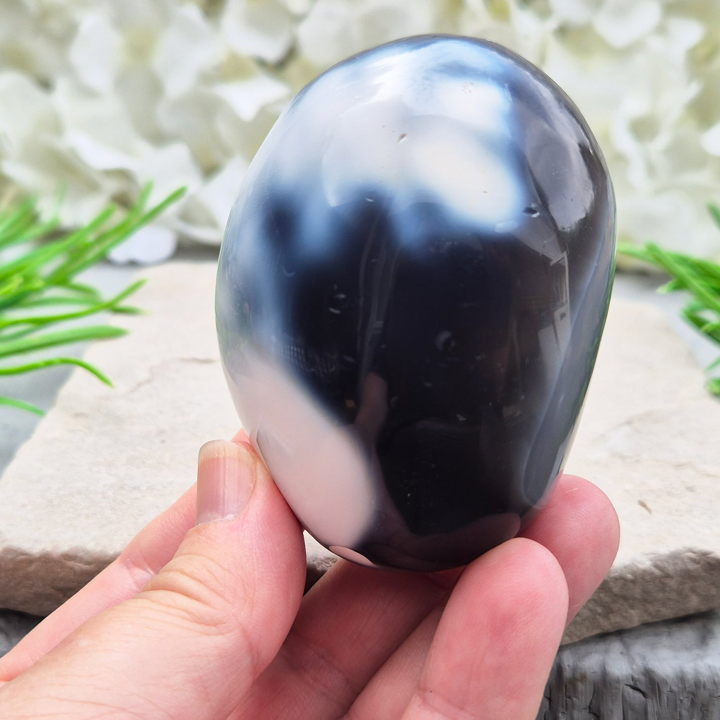 Orca Agate also known as Grey Agate, it has black, dark charcoal grey and white patterning, with soft, out-of-focus white markings as a natural feature of the stone. No two pieces show the same pattern and colouring.