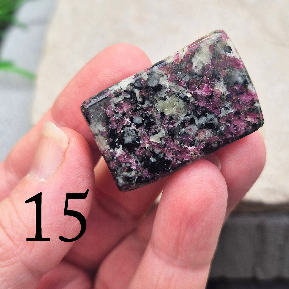 Polished Eudialyte flat stone from Greenland with rich red and pink tones. Associated with emotional steadiness, heart support, and grounded change.