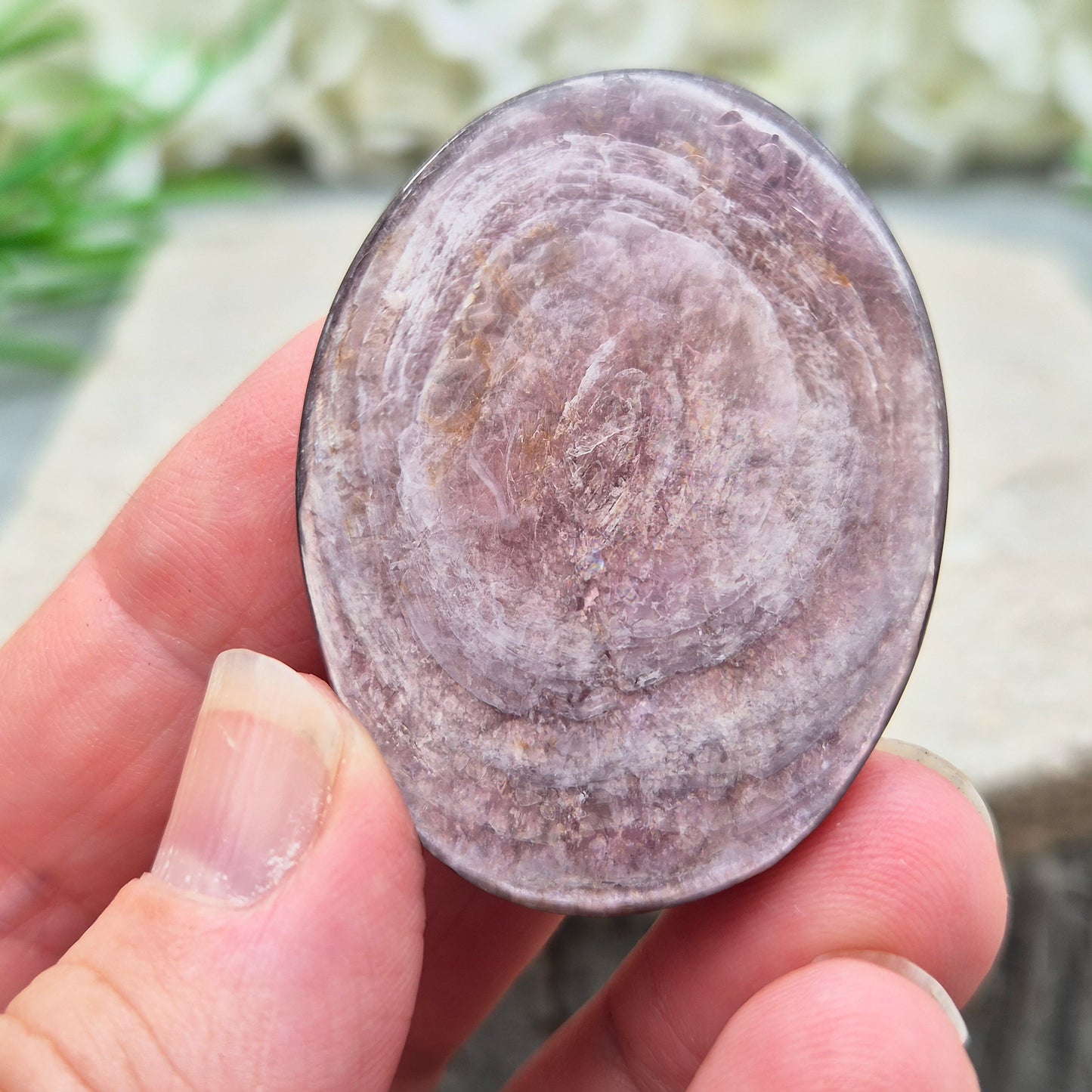 Mica palm stone in shimmering metallic lilac. Perfect for holding, mindful energy, and gifting. Helps steady thoughts, balance emotions, and uplift.