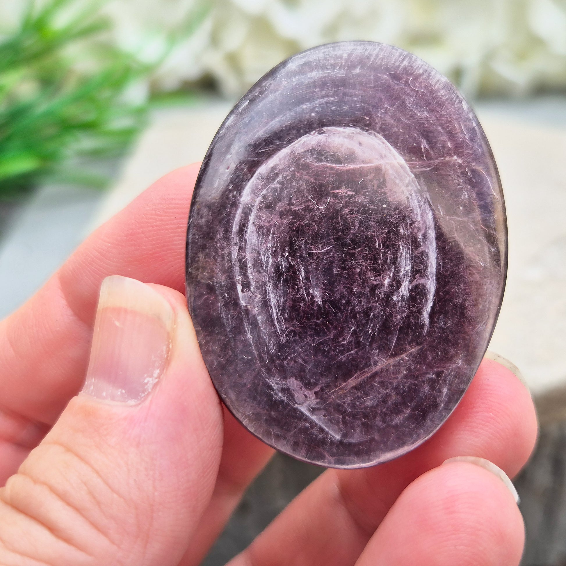 Mica palm stone in shimmering metallic lilac. Perfect for holding, mindful energy, and gifting. Helps steady thoughts, balance emotions, and uplift.