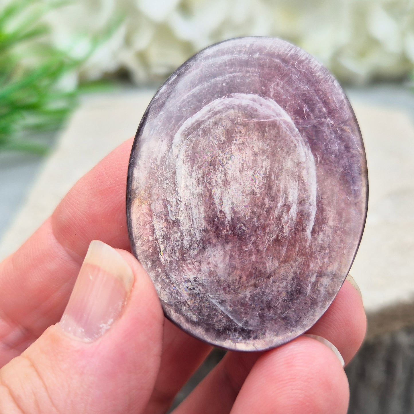 Mica palm stone in shimmering metallic lilac. Perfect for holding, mindful energy, and gifting. Helps steady thoughts, balance emotions, and uplift.